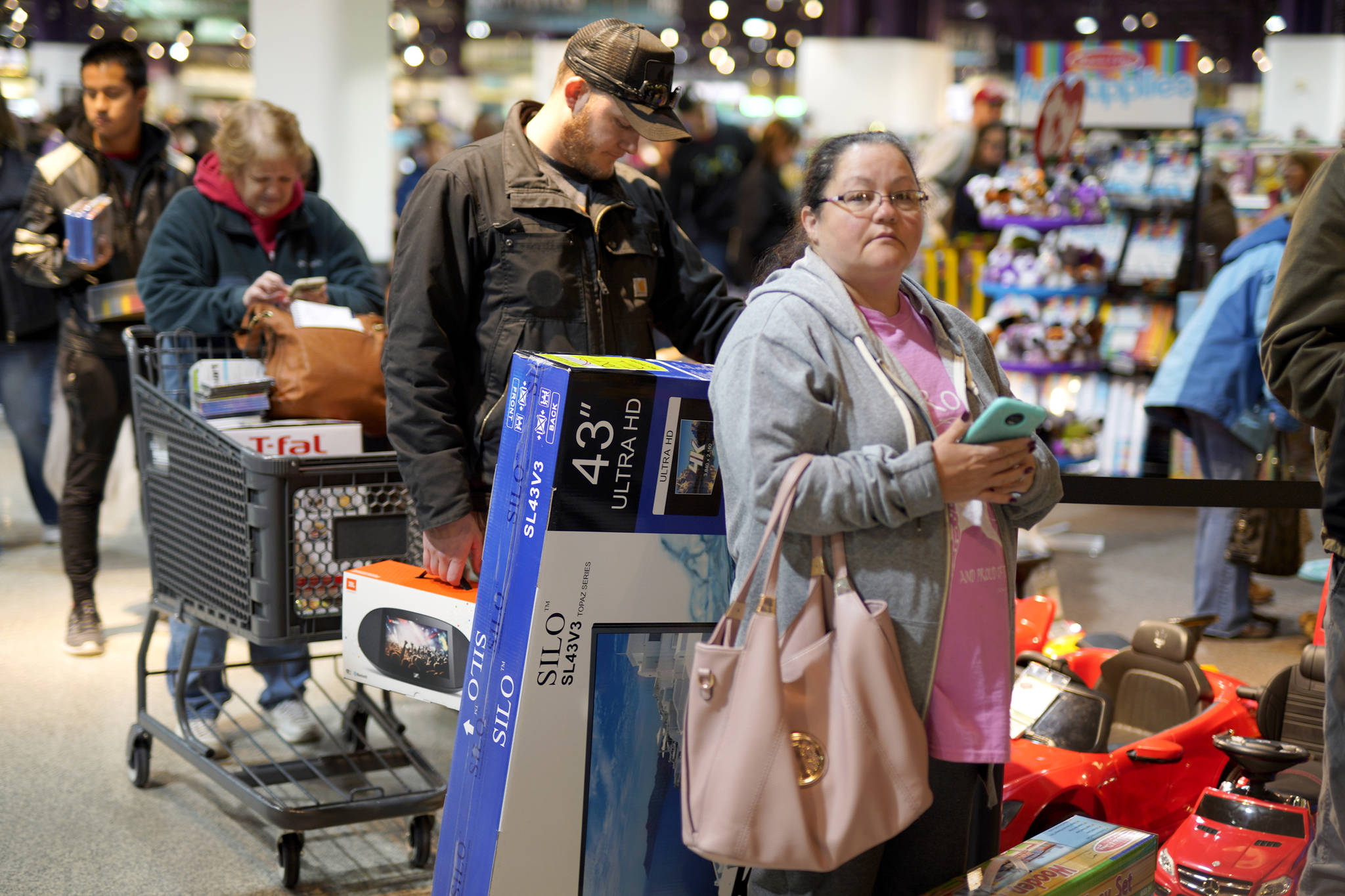 Black Friday shoppers wait in line to check out at the Nebraska Furniture Mart store in Omaha, Nebraska on Friday, Nov. 23, 2018. (Nati Harnik | Associated Press)