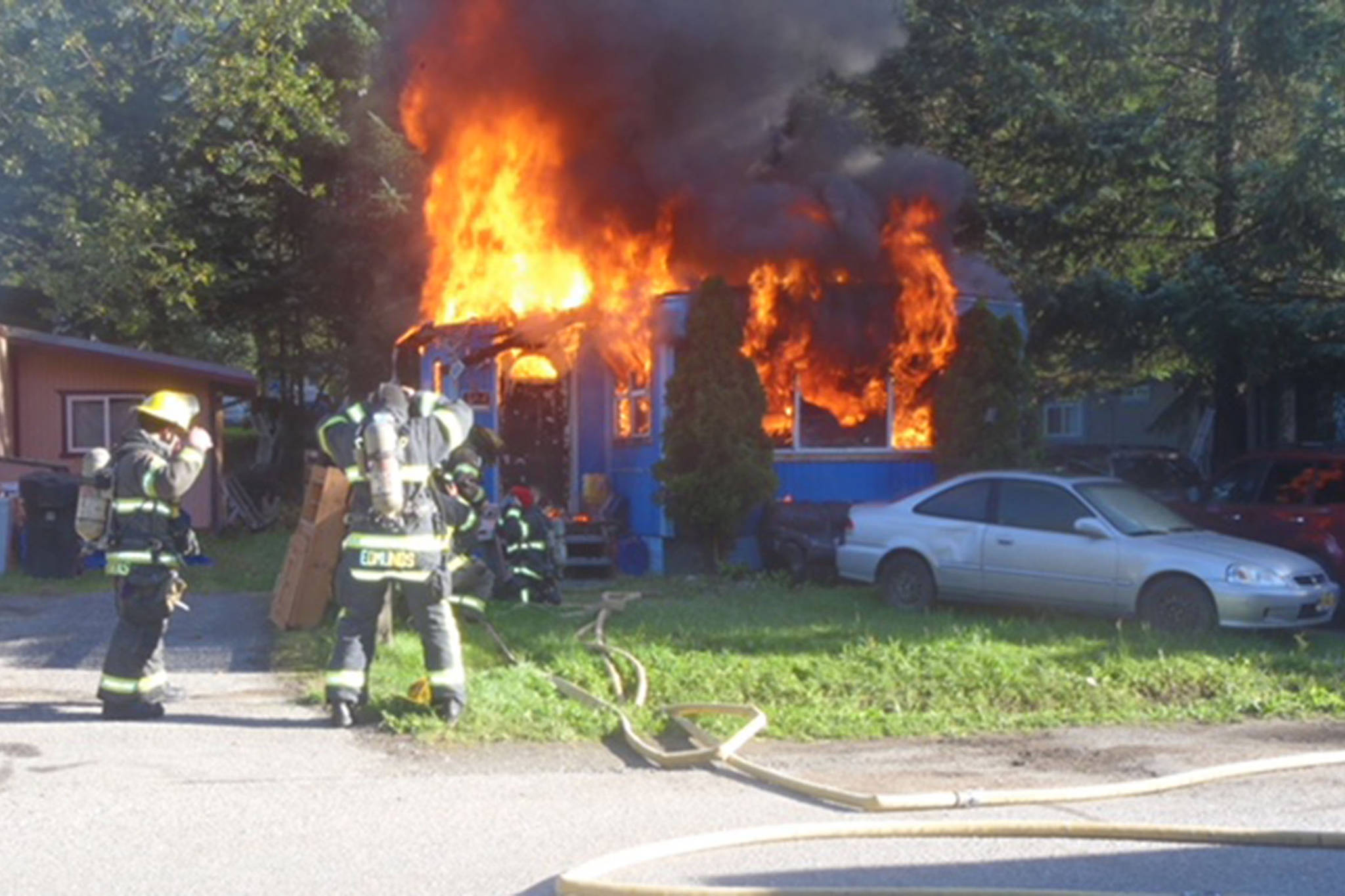 Firefighters battle a fire at a mobile home at Switzer Village Mobile Home Park on Saturday, Aug. 11, 2018. (Capital City Fire/Rescue | Courtesy Photo)
