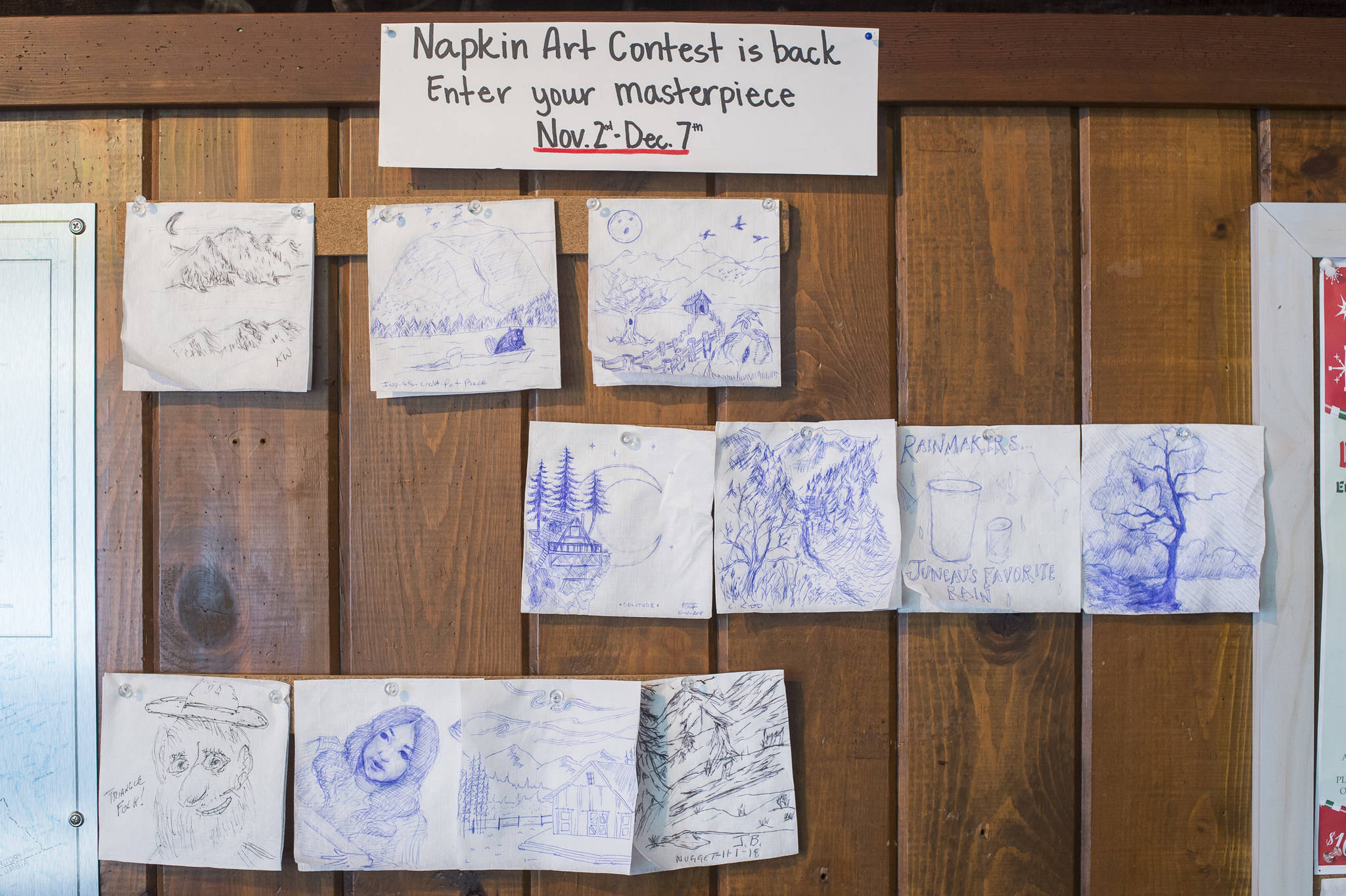 Entries in the Napkin Art Contest at the Triangle Club Bar on Wednesday, Nov. 28, 2018. Winners will be picked during Gallery Walk on Friday, Dec. 7. (Michael Penn | Juneau Empire)