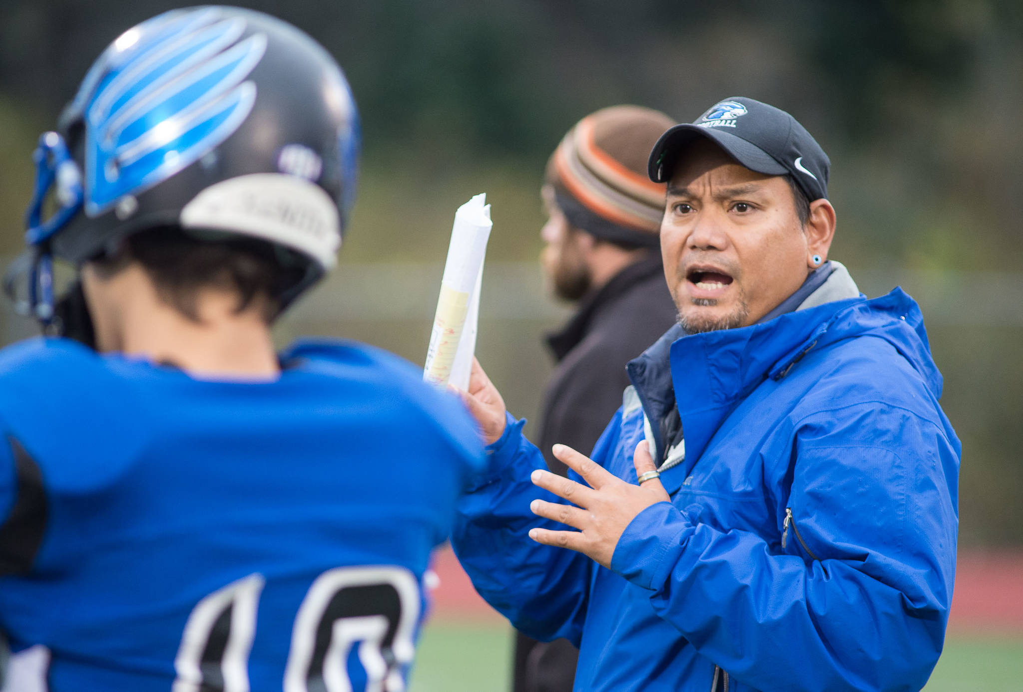 TMHS coach Randy Quinto works with his team at Thunder Mountain High School football practice at TMHS on Wednesday, Oct. 4, 2017. Quinto was the TMHS head coach from 2015-17 and Juneau United head coach last season. (Michael Penn | Juneau Empire File)