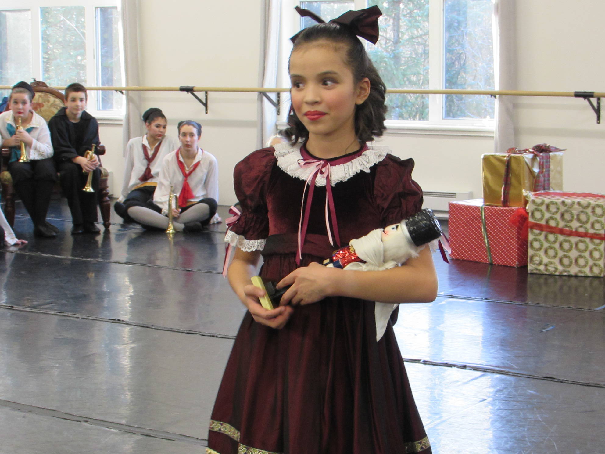 Isabel Danner carries a nutcracker during rehearsal for “The Nutcracker” Saturday, Dec. 1 at Juneau Dance Theatre. (Ben Hohenstatt | Capital City Weekly)