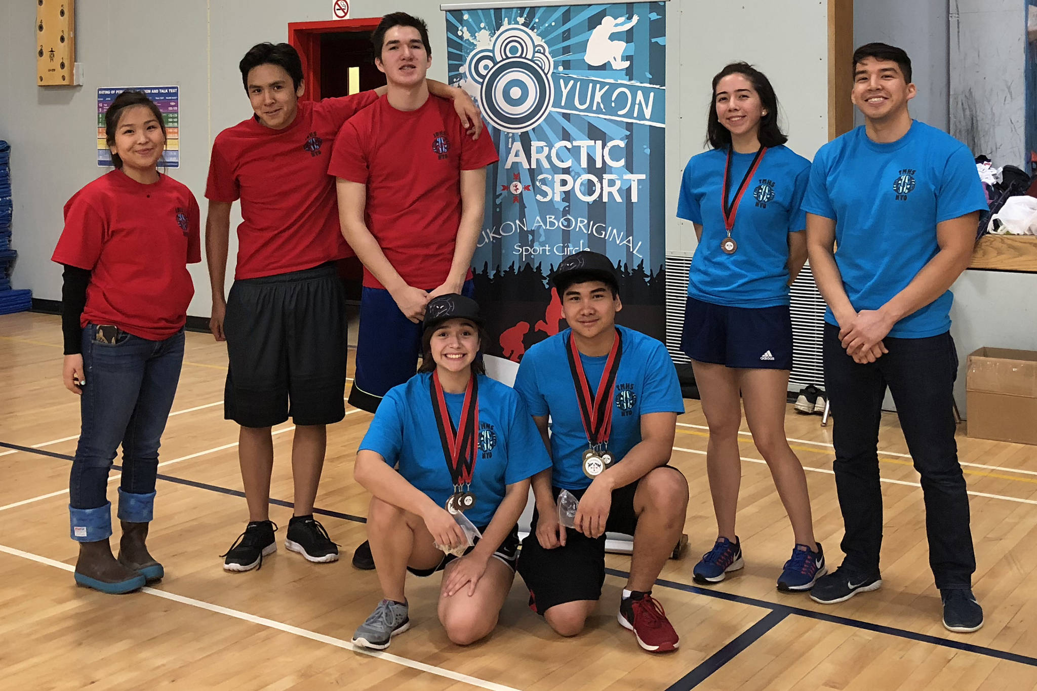 Team Juneau poses with its medals after competing in the Yukon Inter-Schools Arctic Sports Championships at the Porter Creek Secondary School in Whitehorse, Yukon, on Friday, Nov. 30, 2018. Top row (Left to right): Coach Kaytlynne Lewis, Erik Jim, Josh Sheakley, Sara Steeves, coach Kyle Worl. Bottom row: Orion Denny, Matthew Quinto. (Courtesy Photo | Kyle Worl)