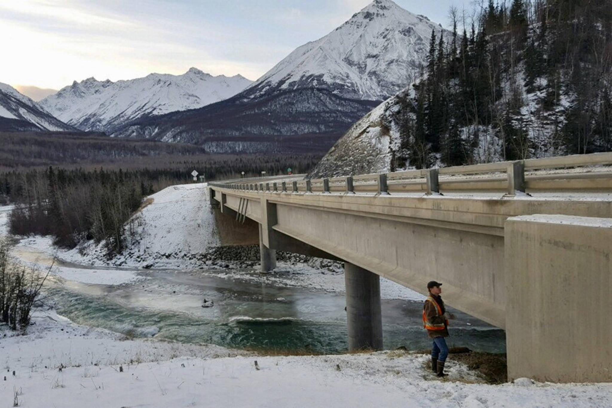 Ben Fetterhoff from the Alaska Department of Transportation and Public Facilities examines the Chicaloon Bridge on the Glenn Highway on Sunday, Dec. 2, 2018. (Courtesy Photo | Alaska DOT&PF)