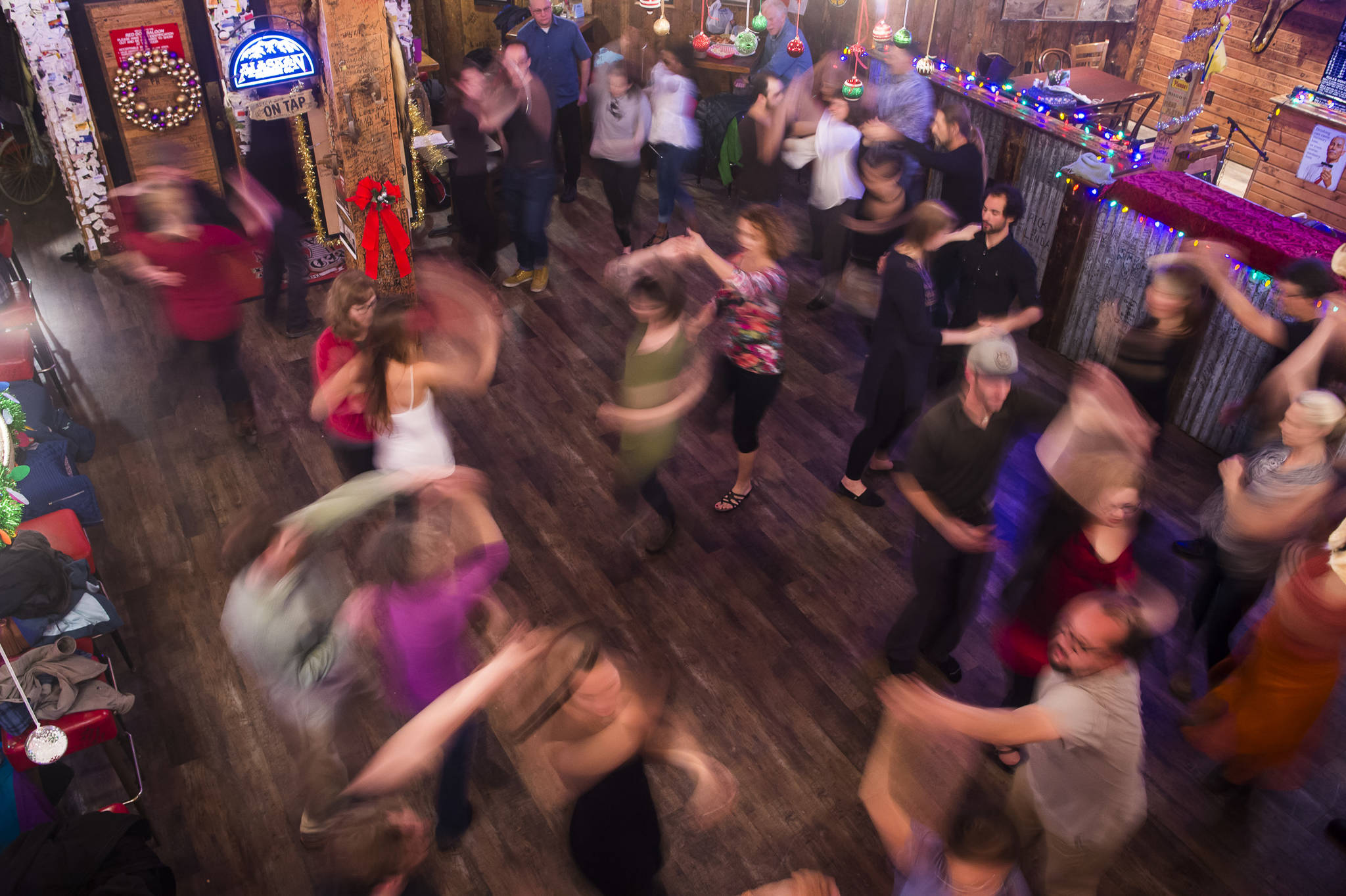 Heather Haugland teaches a salsa workshop at the Red Dog Saloon on Wednesday, Dec. 5, 2018. (Michael Penn | Juneau Empire)