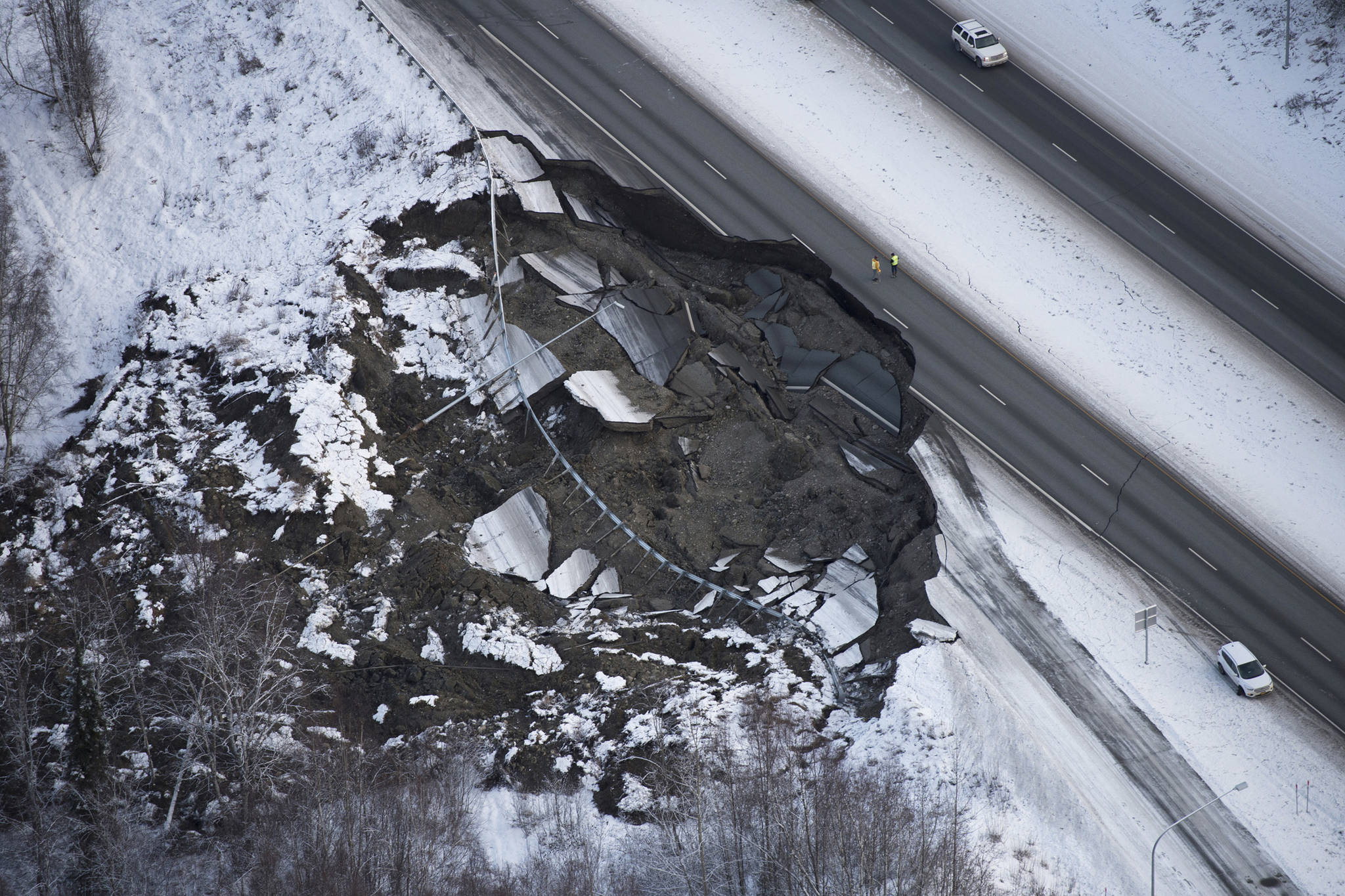 <span class="neFMT neFMT_PhotoCredit"><strong>Marc Lester | Anchorage Daily News</strong><strong></strong></span>                                <span class='IDappliedStyle' title='InDesign: Light'>This aerial photo shows damage at the Glenn Highway near Mirror Lake after earthquakes in the Anchorage area, Alaska, Friday, Nov. 30, 2018. Back-to-back earthquakes measuring 7.0 and 5.7 shattered highways and rocked buildings Friday in Anchorage and the surrounding area, sending people running into the streets and briefly triggering a tsunami warning for islands and coastal areas south of the city. (Marc Lester | Anchorage Daily News)</span>