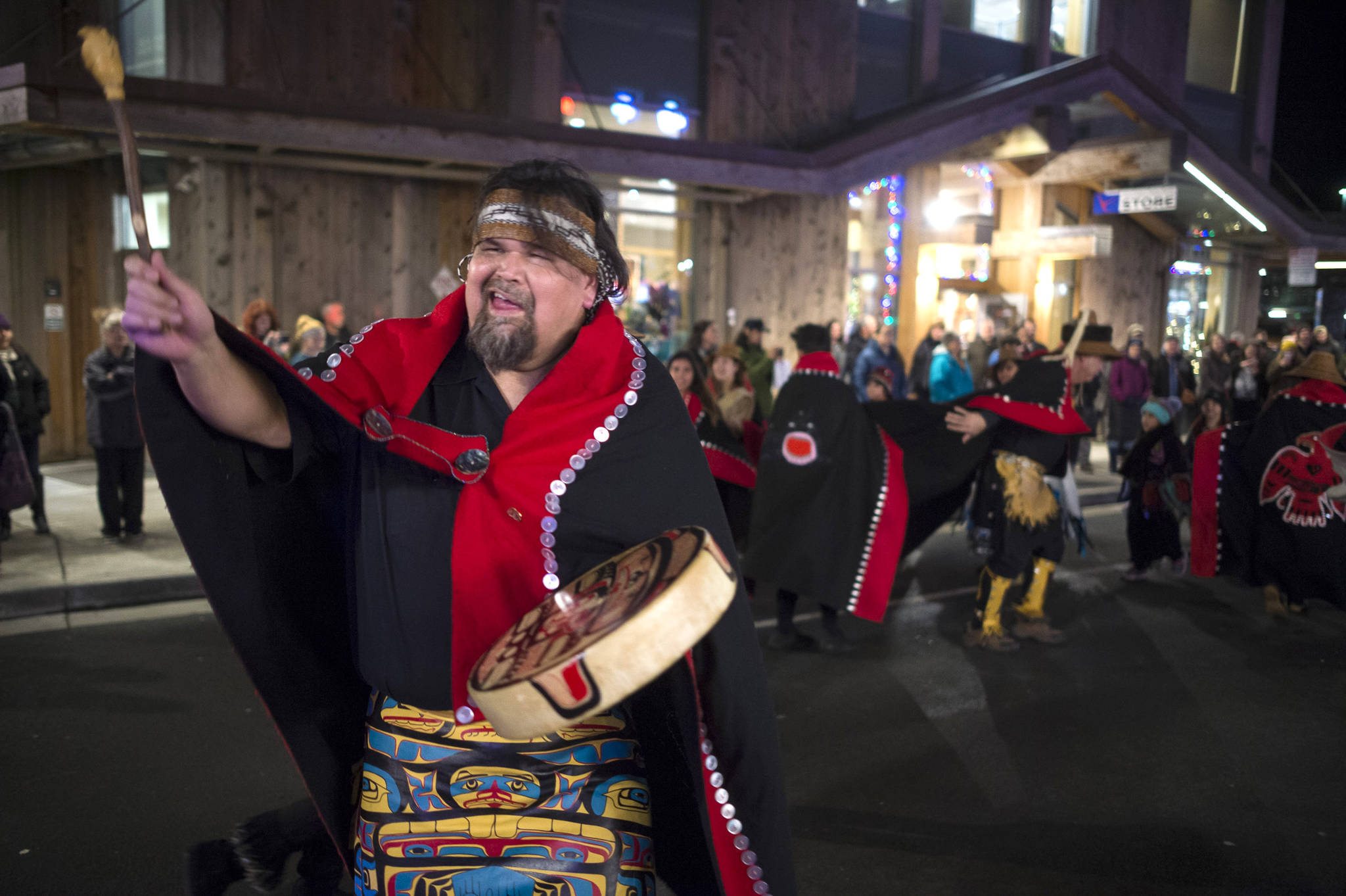 Alfie Price dances with the multicultural dance group Yees Ku Oo on Front Street during Gallery Walk on Friday, Dec. 7, 2018. (Michael Penn | Juneau Empire)