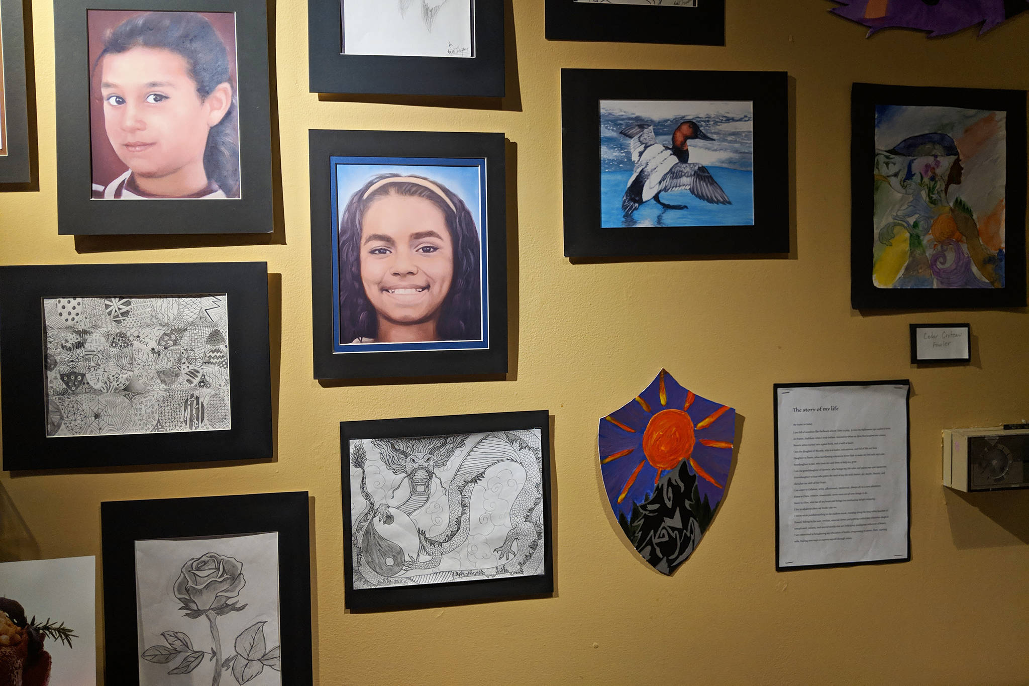 Artwork by Thunder Mountain High School students was displayed during the Juneau Youth Services student art show at Baranof Heritage Cafe on Friday, Dec. 7, 2018. (Ben Hohenstatt | Capital City Weekly)