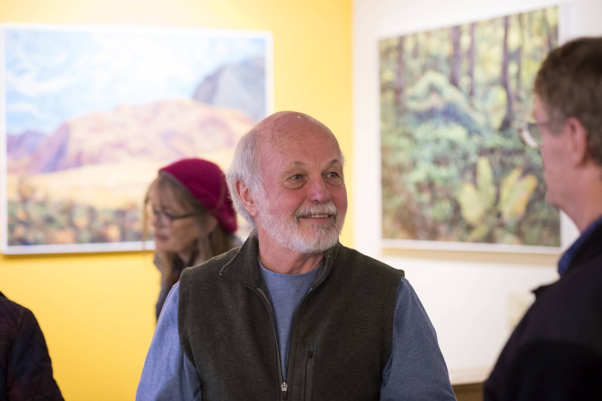 Jim Fowler talks about his new landscape paintings at Coppa during Gallery Walk on Friday, Dec. 7, 2018. (Michael Penn | Juneau Empire)