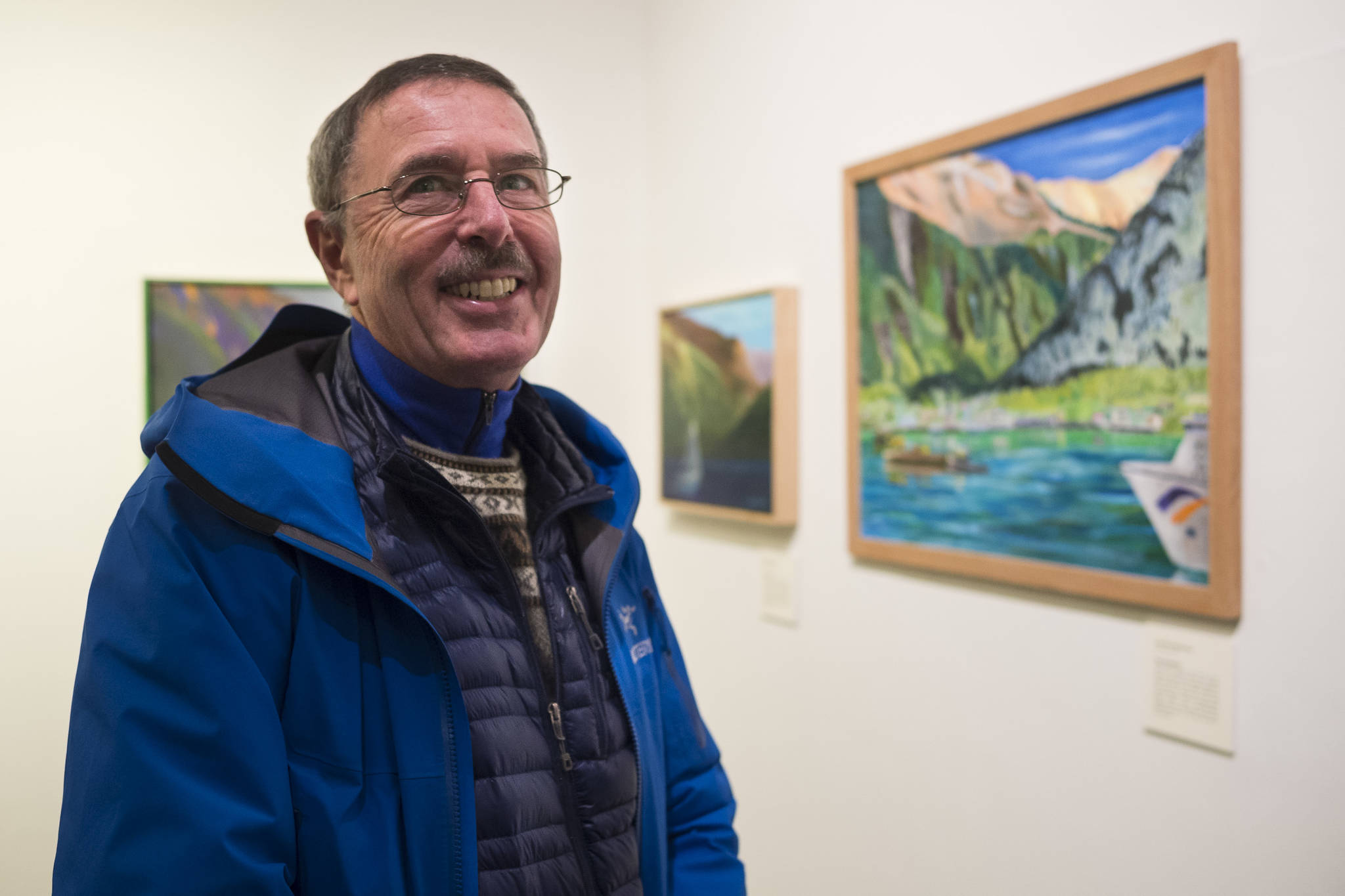 Tom Bornstein is one of 19 Plein Rein Painters inspired by Sydney Laurence at the Juneau-Douglas City Museum during Gallery Walk on Friday, Dec. 7, 2018. (Michael Penn | Juneau Empire)