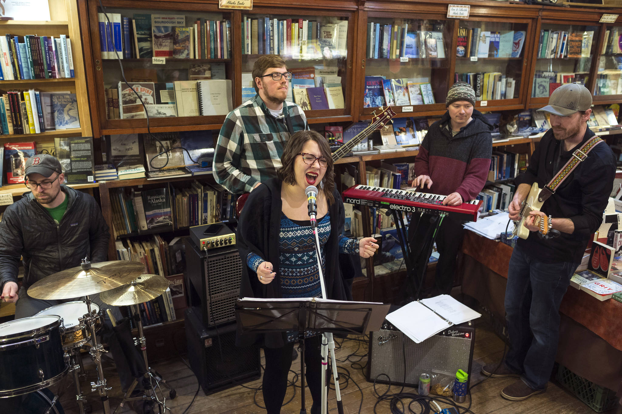 The Flustered Cluckers perform at Rainy Retreat Books during Gallery Walk on Friday, Dec. 7, 2018. (Michael Penn | Juneau Empire)