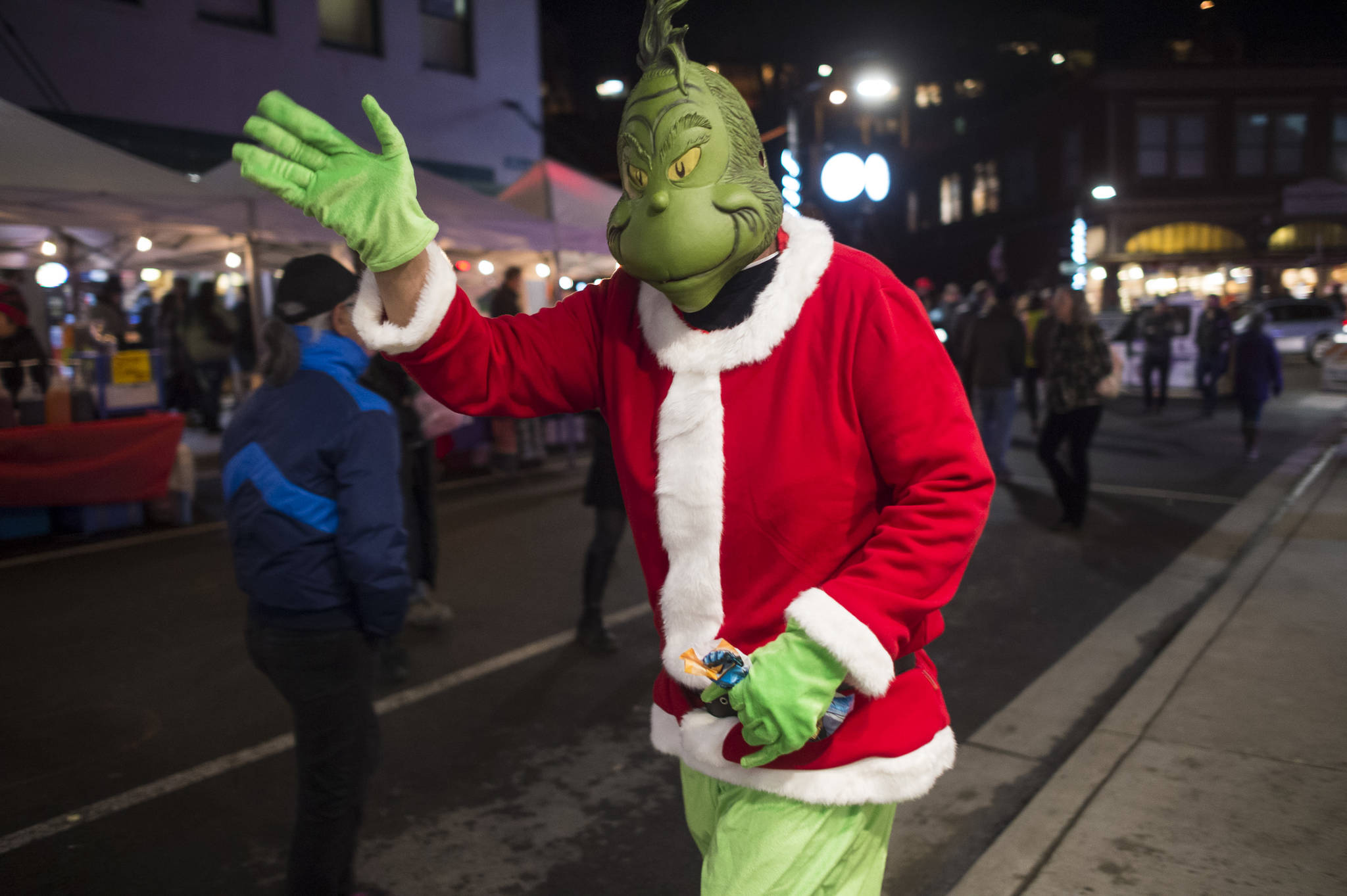 The Grinch makes his appearance on Front Street during Gallery Walk on Friday, Dec. 7, 2018. (Michael Penn | Juneau Empire)