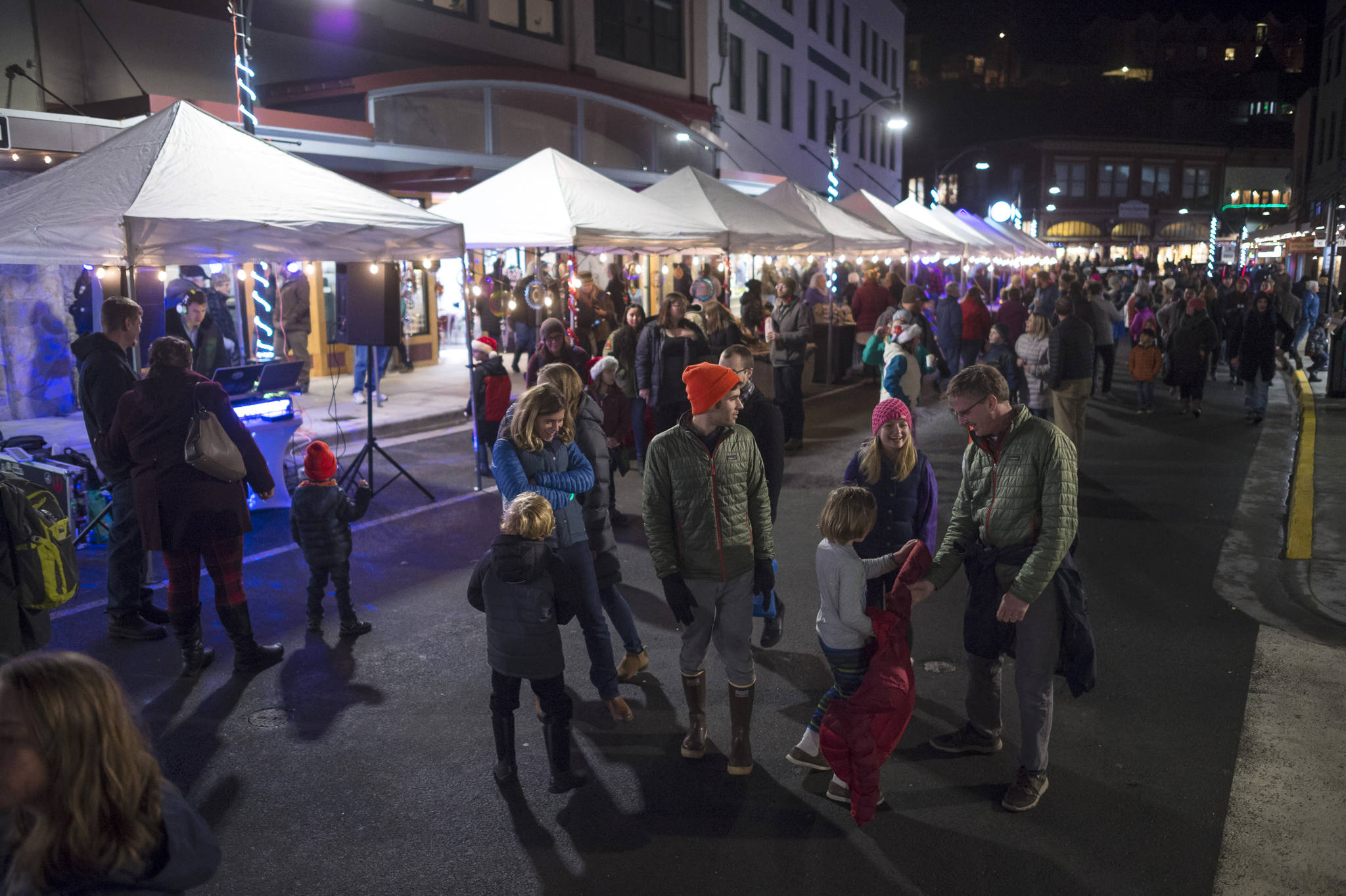 People gather on Front Street during Gallery Walk on Friday, Dec. 7, 2018. (Michael Penn | Juneau Empire)