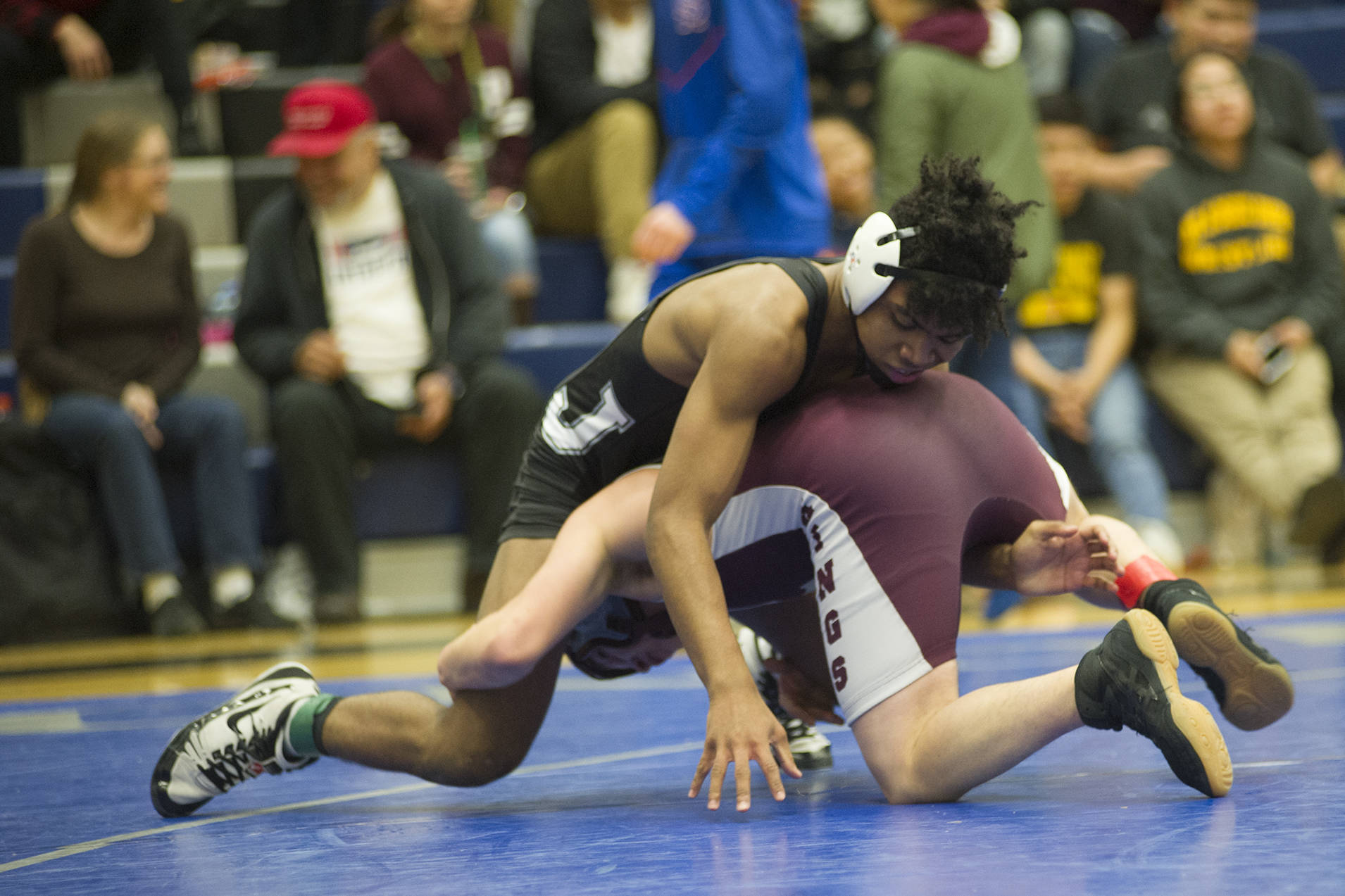 Thunder Mountain’s Jahrease Mays wrestles Ketchikan’s Matthew Rodriguez during their 125-pound finals match in the Region V Division I Wrestling Championships at TMHS on Saturday, Dec. 8, 2018. Rodriguez earned a 3-2 decision to win the region title. (Nolin Ainsworth | Juneau Empire)