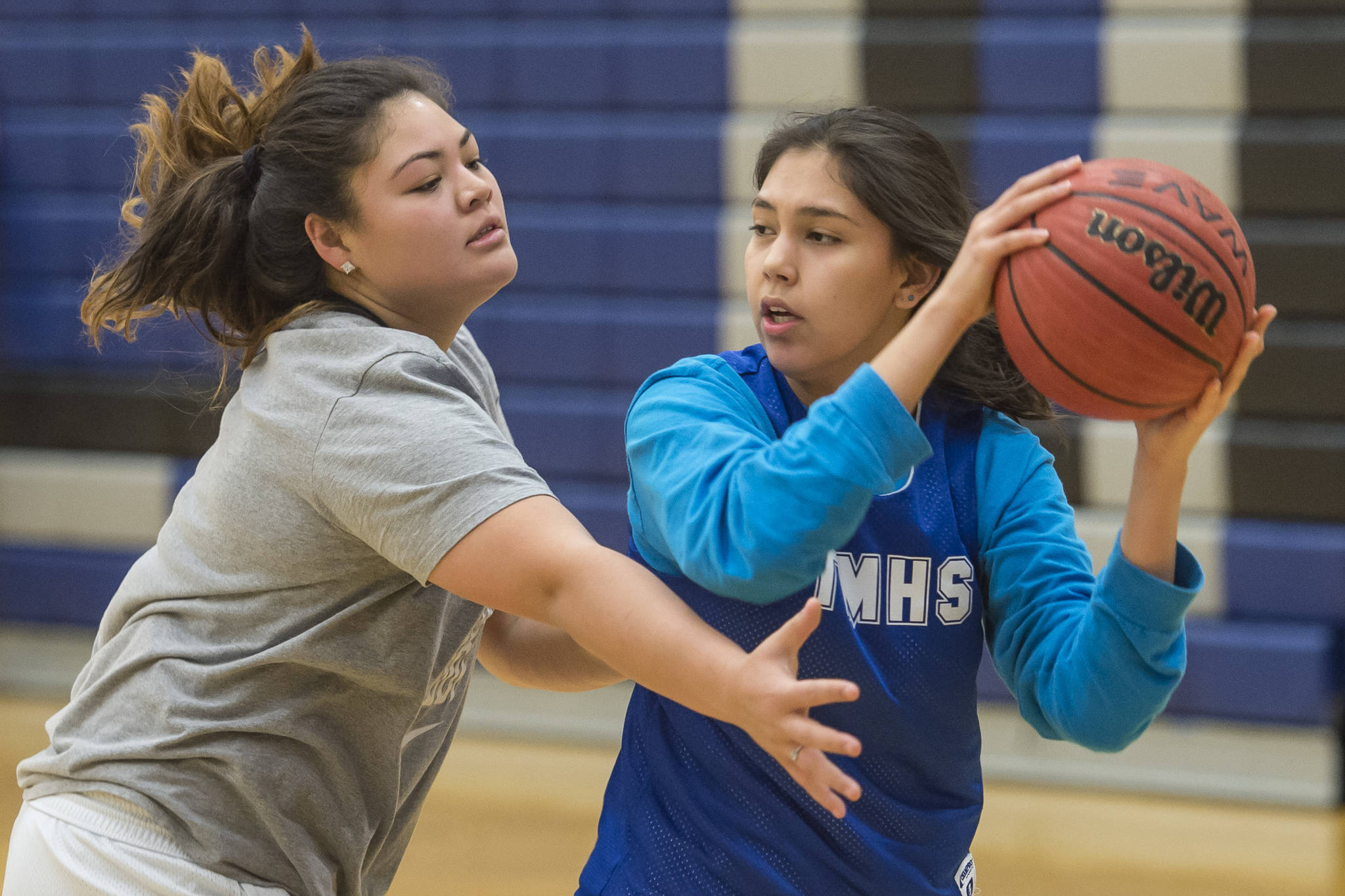 Nina Fenumiai, left, guards teammate Kira Frommherz during early morning girls basketball practice at Thunder Mountain High School on Tuesday, Dec. 11, 2018. (Michael Penn | Juneau Empire)