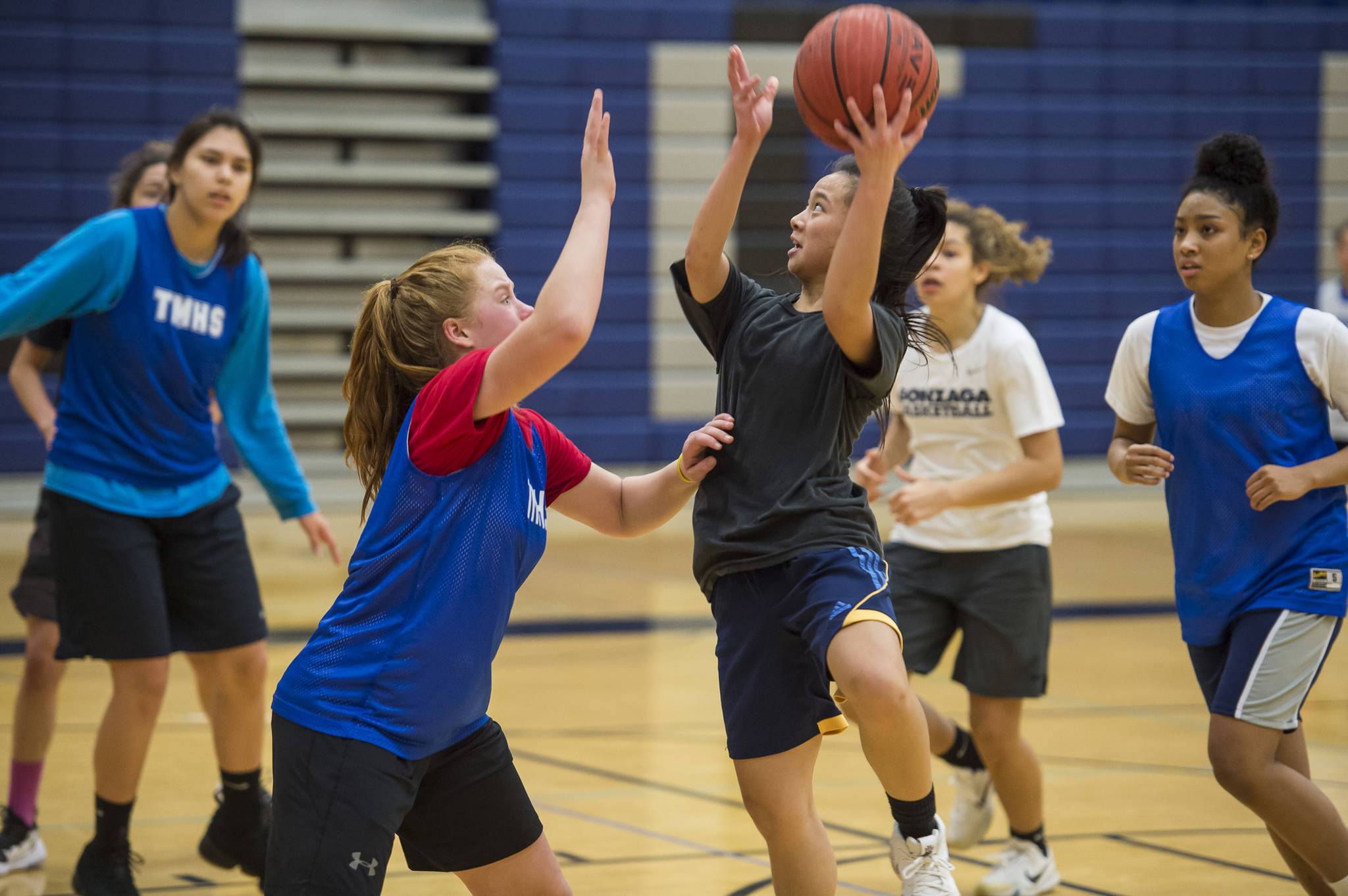 Mary Khaye Garcia shoots over teammate Sydney Strong during early morning girls basketball practice at Thunder Mountain High School on Tuesday, Dec. 11, 2018. (Michael Penn | Juneau Empire)