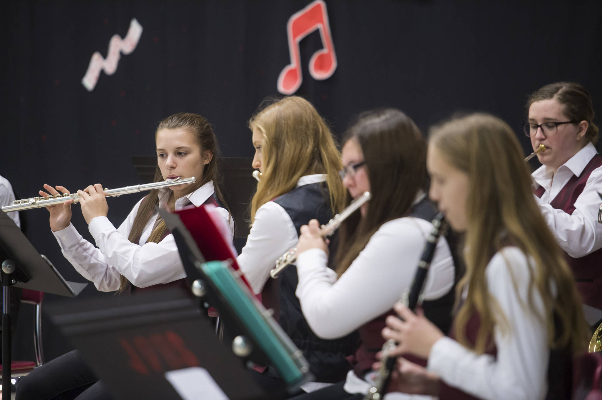 Students with the Juneau-Douglas High School Concert Band play during a holiday music concert at JDHS on Thursday, Dec. 13, 2018. (Michael Penn | Juneau Empire)