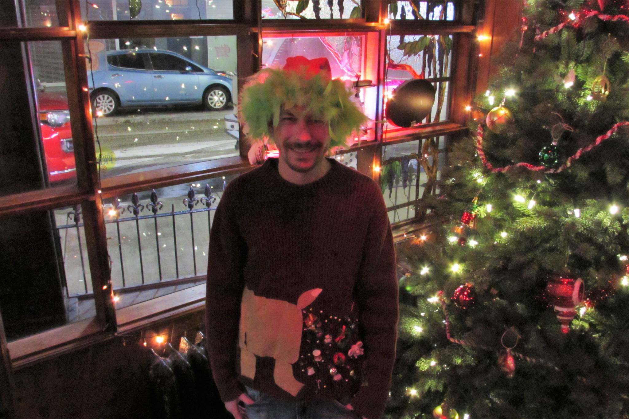 Wes Young’s sweater was among the oddest if not the ugliest at the Alaskan Hotel and Bar’s ugly Christmas sweater and clothing drive Saturday, Dec. 15, 2018.(Ben Hohenstatt | Capital City Weekly)