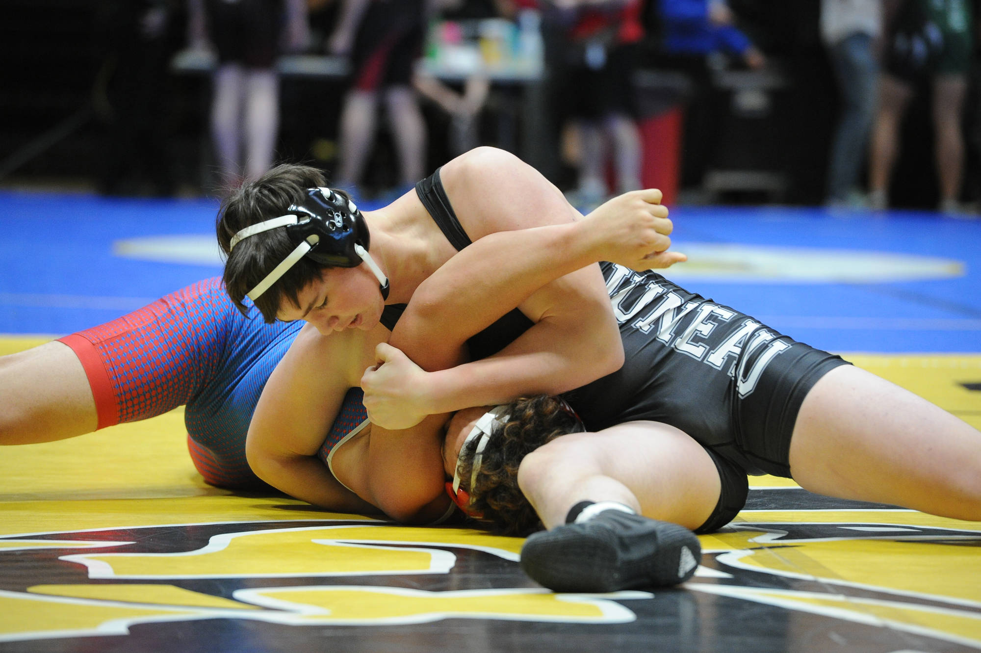 Thunder Mountain High School sophomore Jacob Ferster pins East Anchorage’s Ikaska Vaivai in the second round of the 215-pound consolation bracket of the ASAA/First National Bank Alaska Division I State Wrestling Championships at the Alaska Airlines Center in Anchorage on Saturday, Dec. 15, 2018. (Michael Dinneen | For the Juneau Empire)