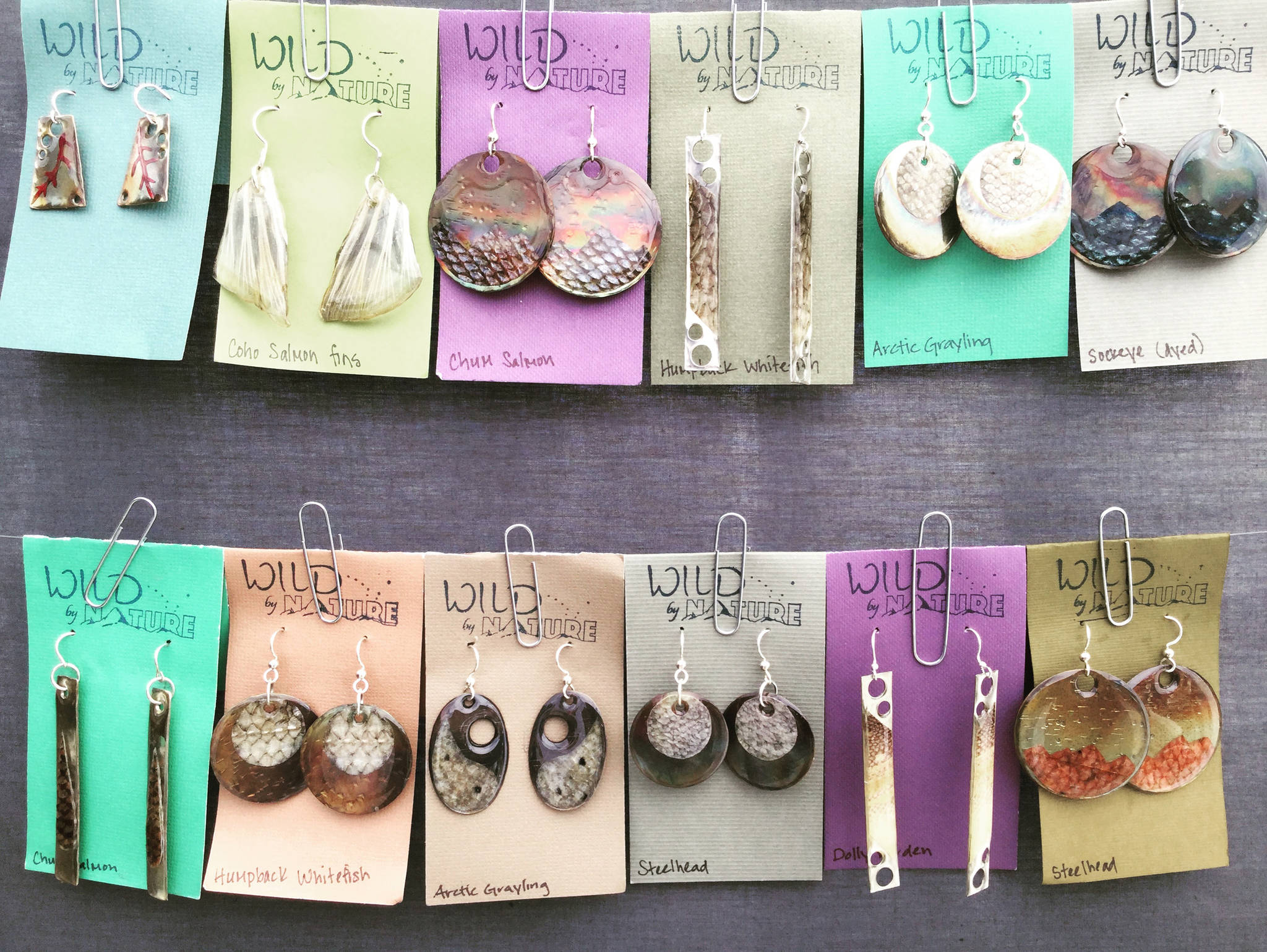 Some of artist Julienne Pacheco’s most recent earring designs, seen here as shown for sale at Juneau’s 2018 Public Market, an annual event held each November. (Courtesy Photo | Julienne Pacheco)