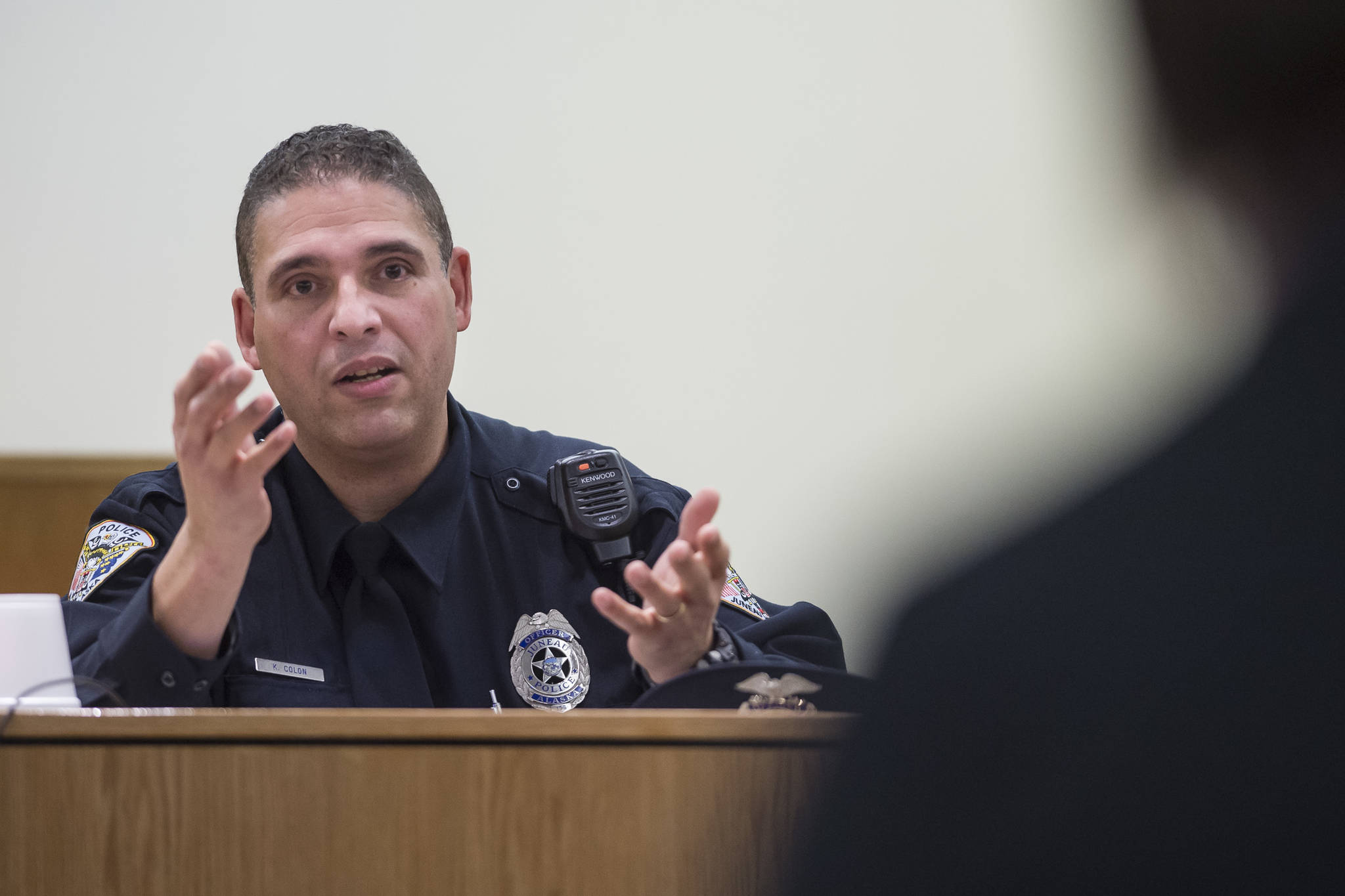 Juneau Police Department Officer Ken Colon is questioned by Assistant Municipal Attorney Emily Wright during the trial of Domanic Quick, 23, in Juneau District Court on Tuesday, Dec. 18, 2018. Quick is on trial on two counts of assault on a police officer, resisting arrest, disorderly conduct and criminal mischief. (Michael Penn | Juneau Empire)