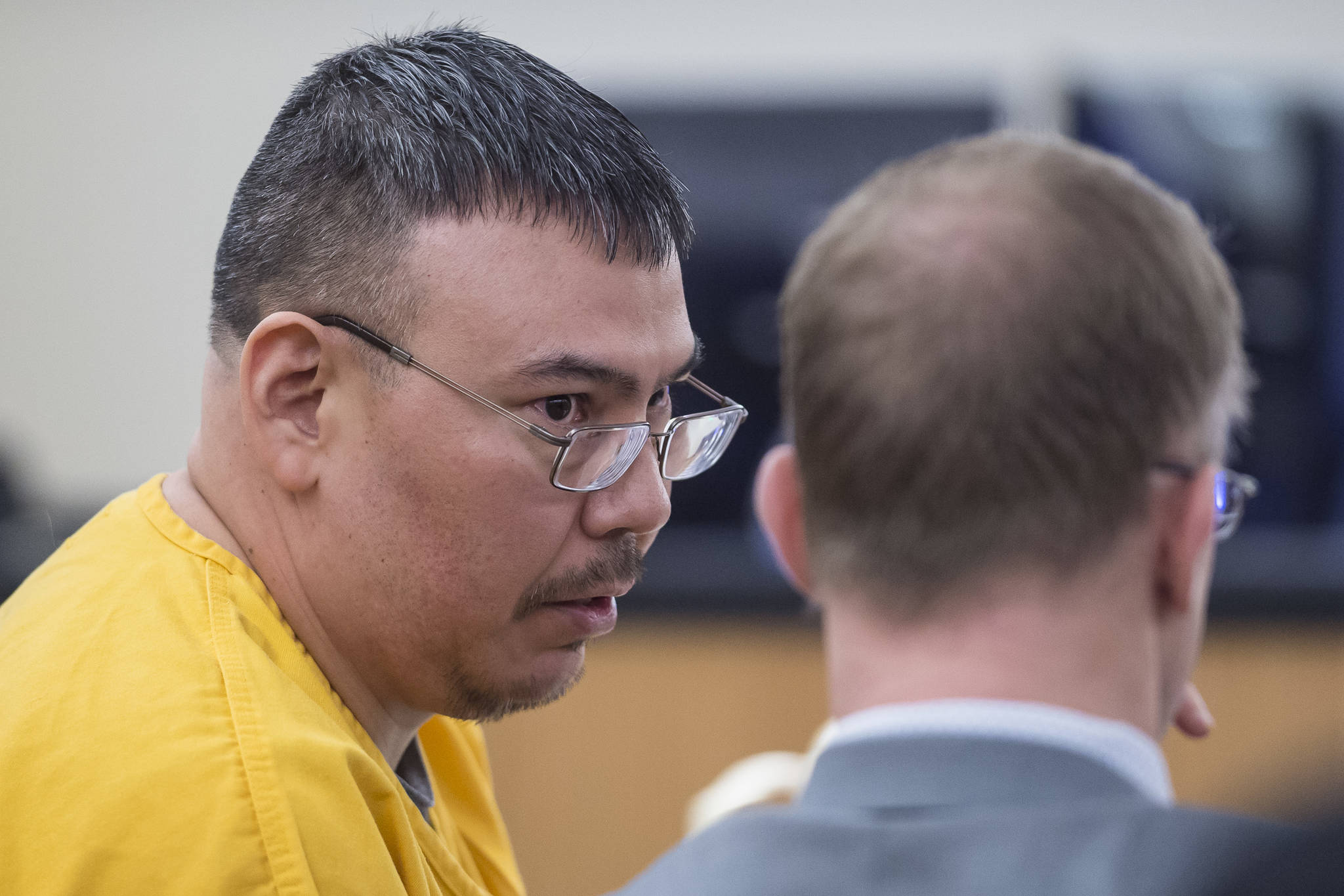 Thomas Jack Jr., 42, speaks with his defense attorney Richard Payne during his sentencing in Juneau Superior Court for sexually abusing an 11-year-old girl placed in his and his wife’s care in 2009. (Michael Penn | Juneau Empire)