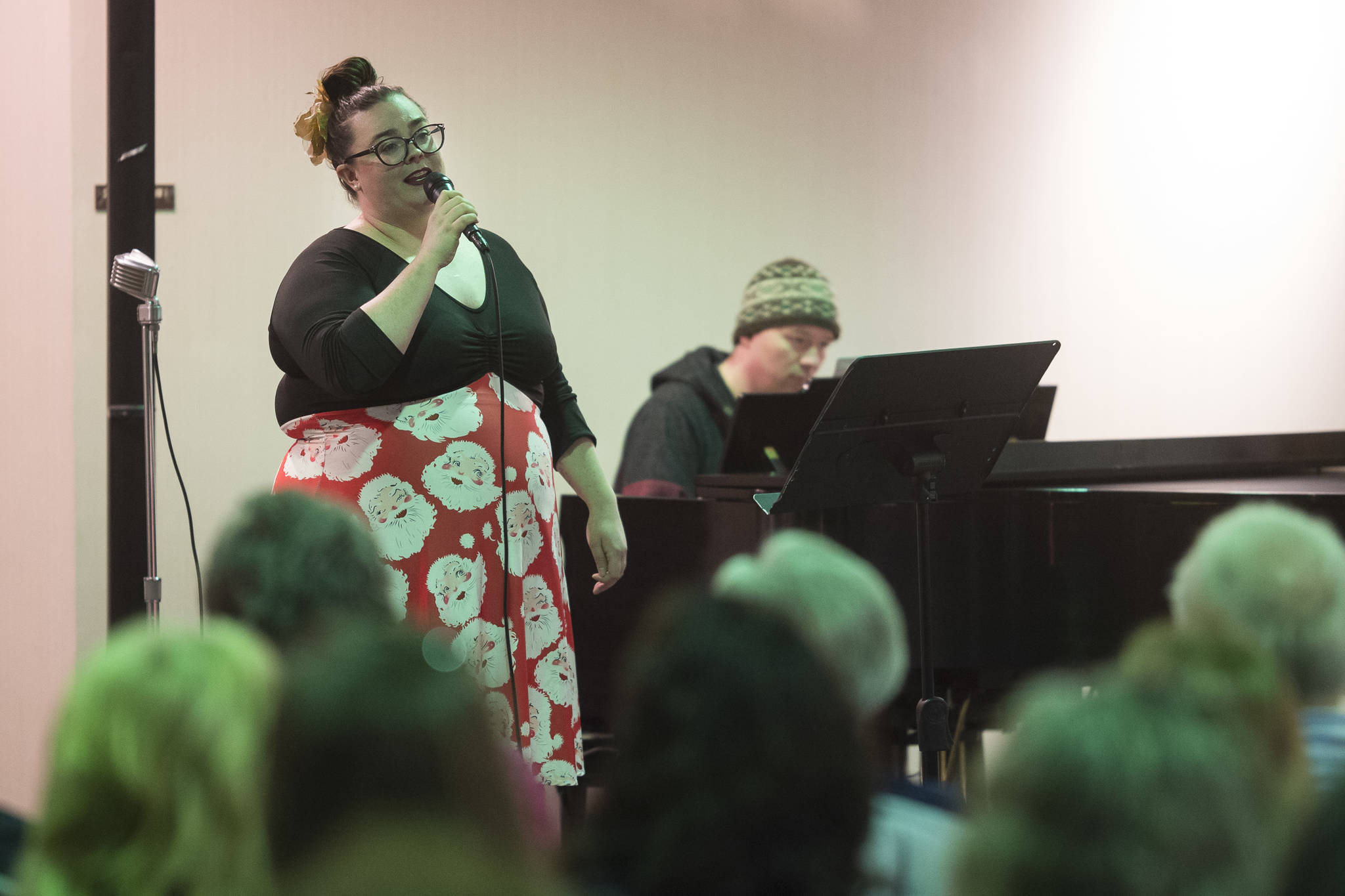 Juneau Cabaret singer Anneka Knotts Morgan sings for Juneau residents as she is accompanied by Luke Weld during the third annual Holiday Extravaganza at Centennial Hall on Wednesday, Dec. 19, 2018. (Michael Penn | Juneau Empire)