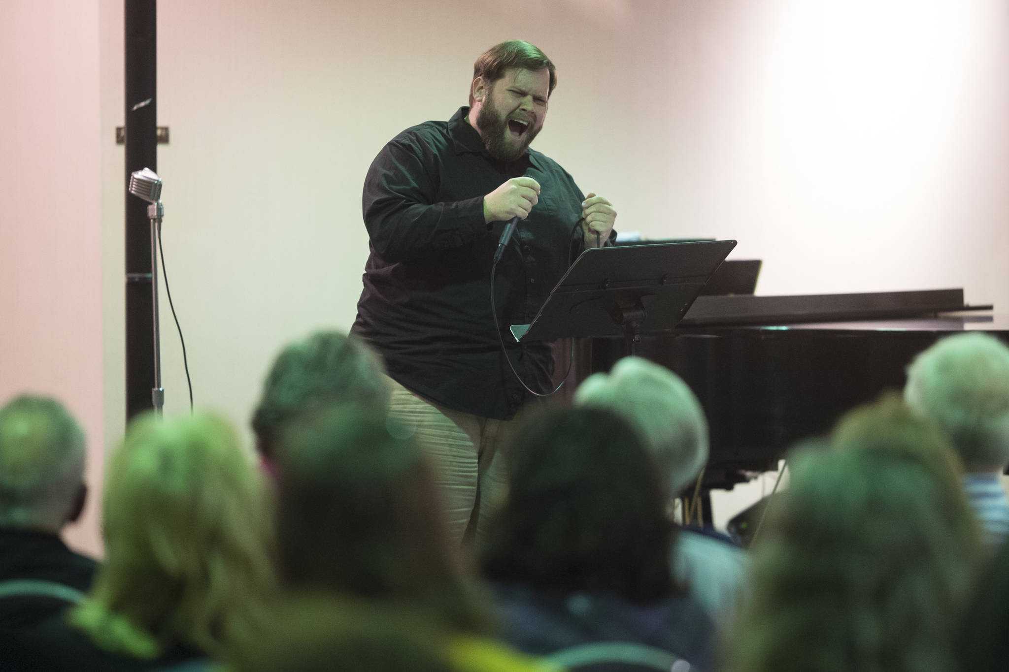 Juneau Cabaret singer Mike Gamble sings for Juneau residents during the third annual Holiday Extravaganza at Centennial Hall on Wednesday, Dec. 19, 2018. (Michael Penn | Juneau Empire)