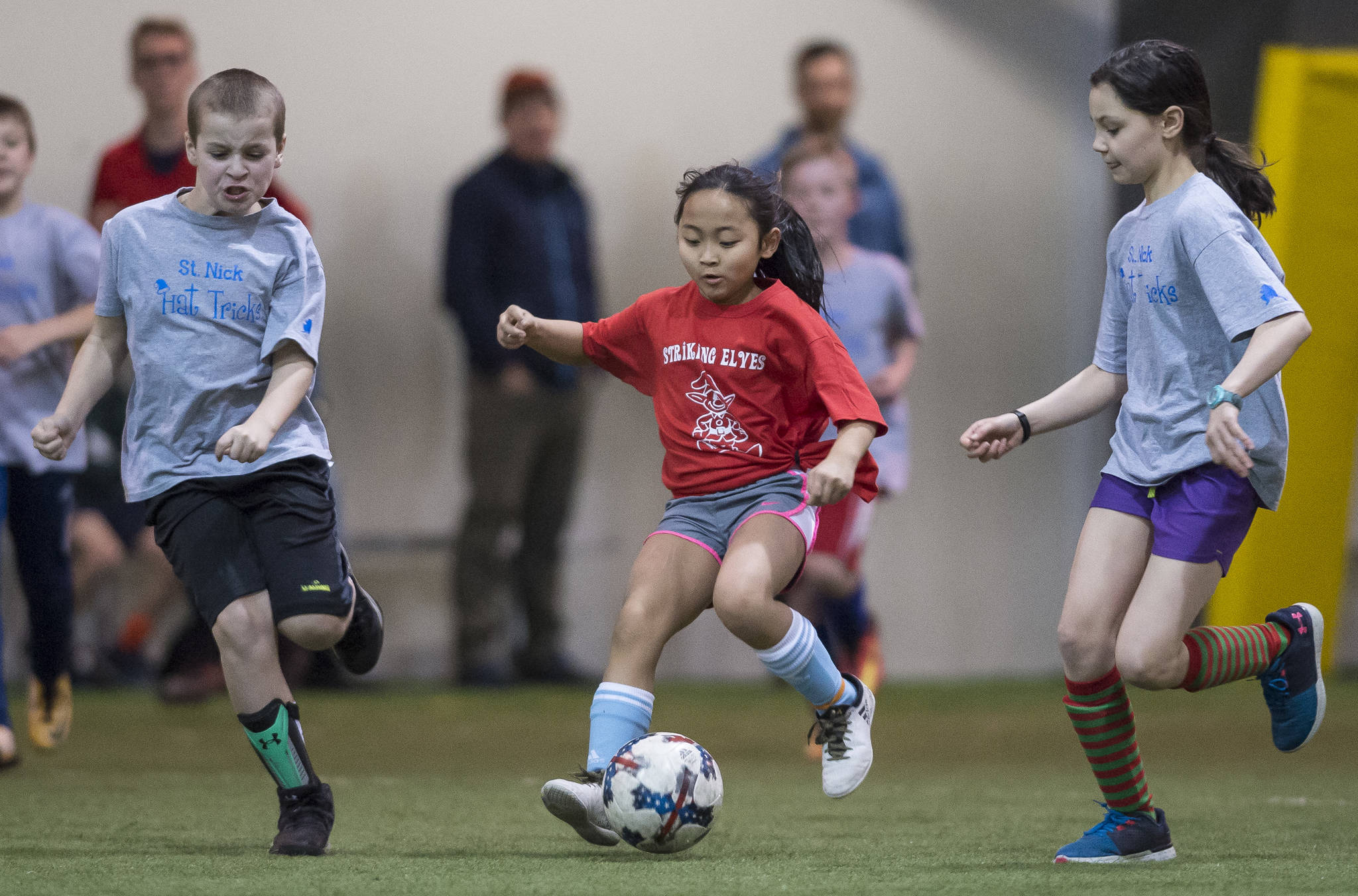 Striking Elves play against the St. Nick Hat Tricks at the Holiday Cup Soccer Tournament in the Well Fargo Dimond Park Field House on Friday, Dec. 22, 2017. The Holiday Cup is underway again now through New Years Eve with 400 players on 30 different teams. (Michael Penn | Juneau Empire File)