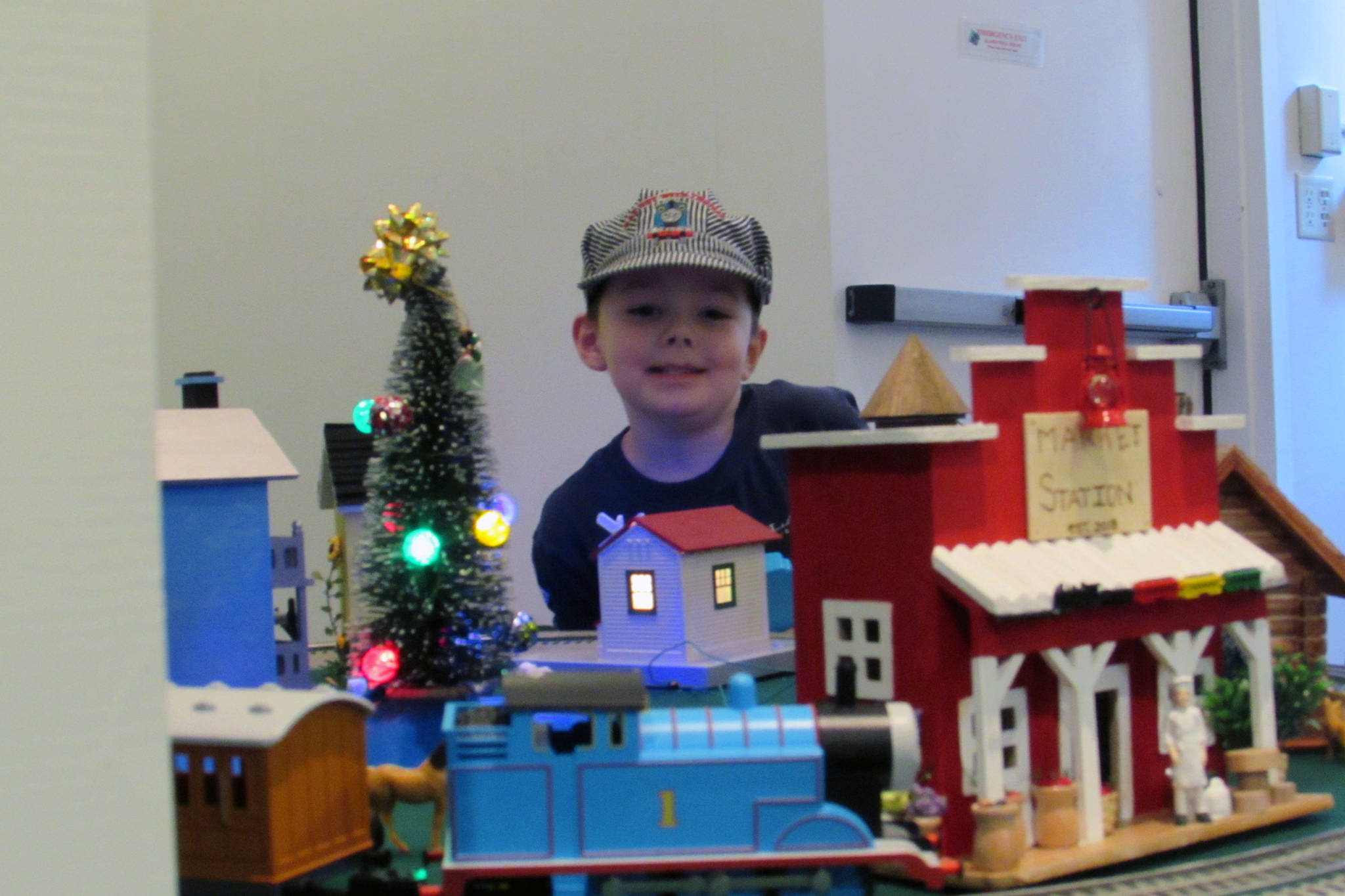 Alec Muldoon, 5, smiles as Thomas the Tank Engine makes his rounds during a model train invitational Saturday, Dec. 22, 2018. (Ben Hohenstatt | Capital City Weekly)