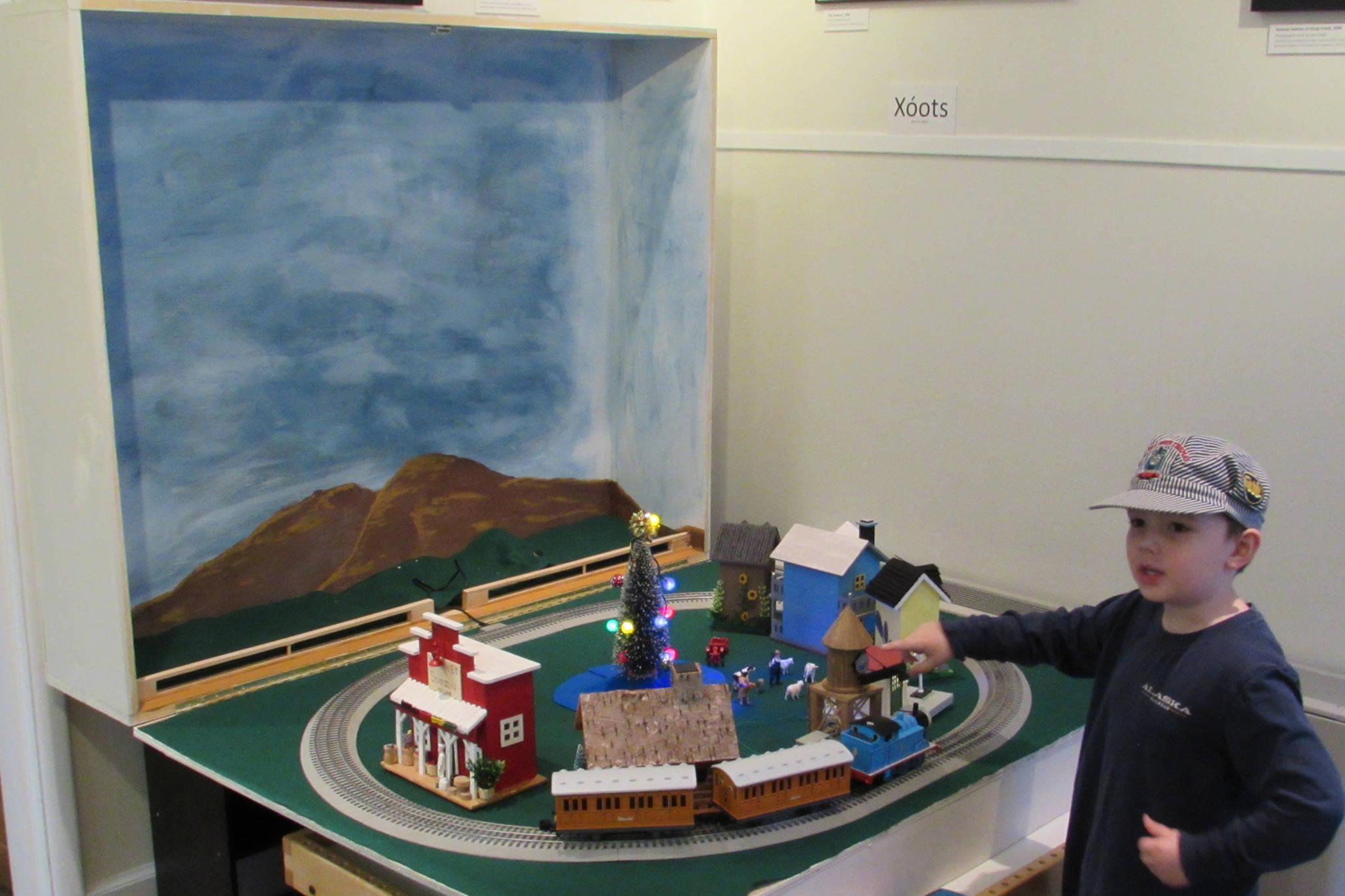 Alec Muldoon, 5, had a train-in-a-box set up at Juneau-Douglas City Museum Saturday, Dec. 22, 2018. Once opened up, the box provided a backdrop for the track. (Ben Hohenstatt | Capital City Weekly)