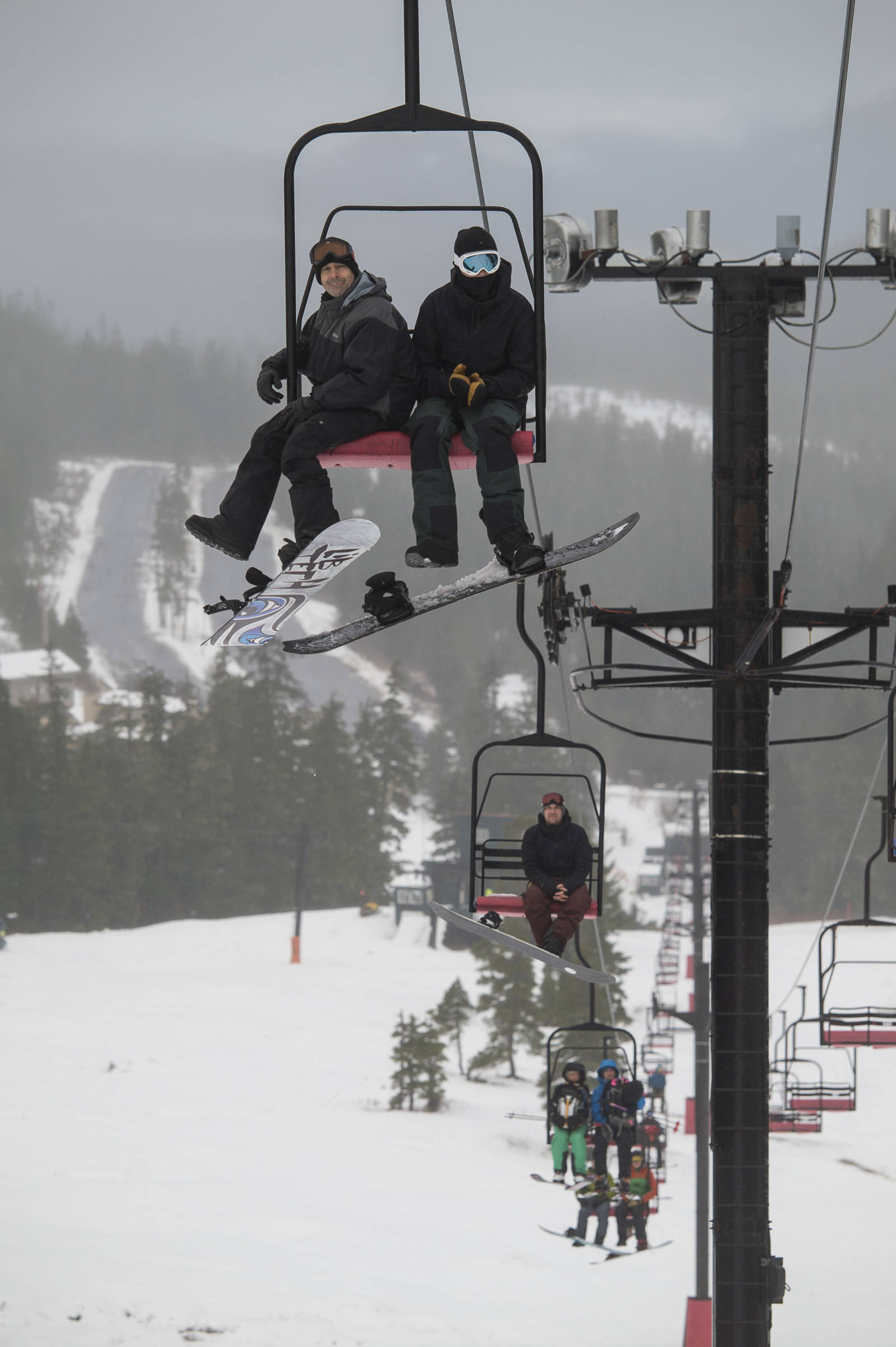 Early birds ride the Hooter Chairlift at Eaglecrest on Monday, Dec. 17, 2018. (Michael Penn | Juneau Empire)