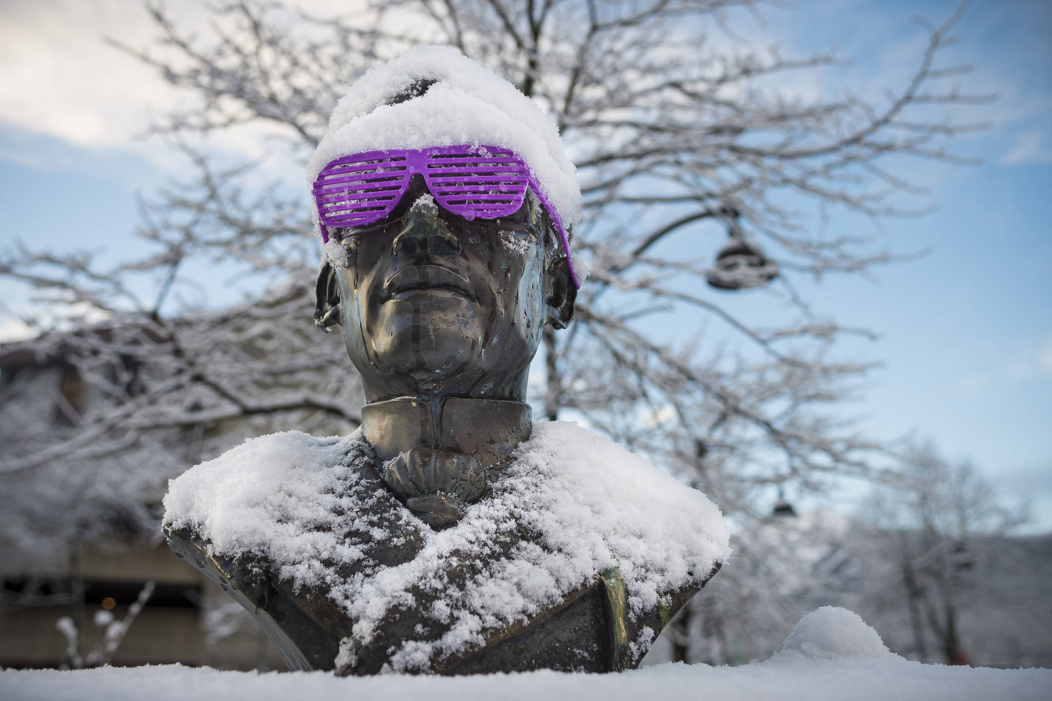 The Bust of Dr. Jose P. Rizal at Manila Square sports shutter shades and a fresh coat of snow in downtown Juneau on Thursday, Dec. 20, 2018. (Michael Penn | Juneau Empire)