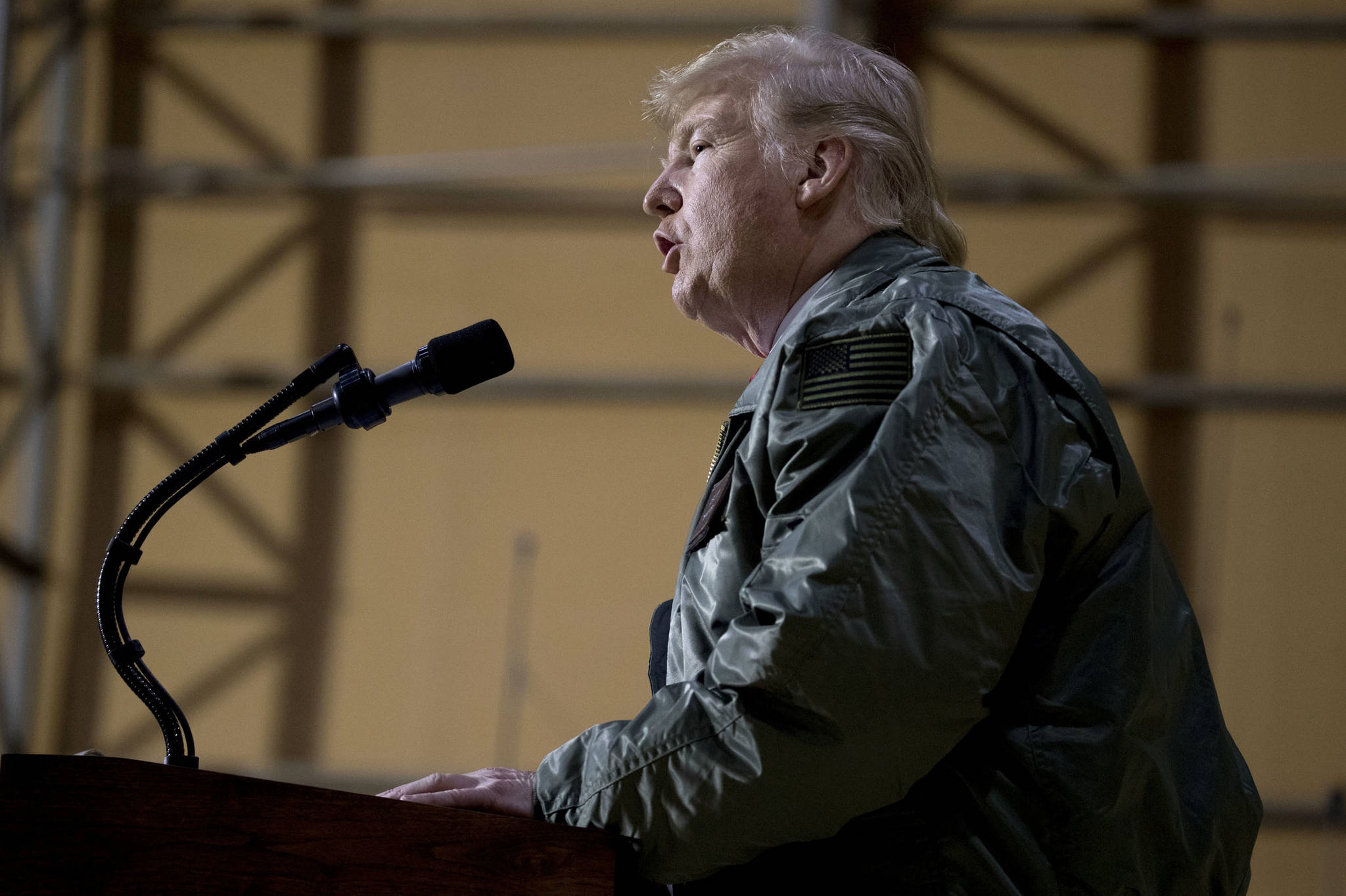 President Donald Trump speaks at a hanger rally at Al Asad Air Base, Iraq, Wednesday, Dec. 26, 2018. In a surprise trip to Iraq, President Donald Trump on Wednesday defended his decision to withdraw U.S. forces from Syria where they have been helping battle Islamic State militants. (Andrew Harnik | Associated Press)