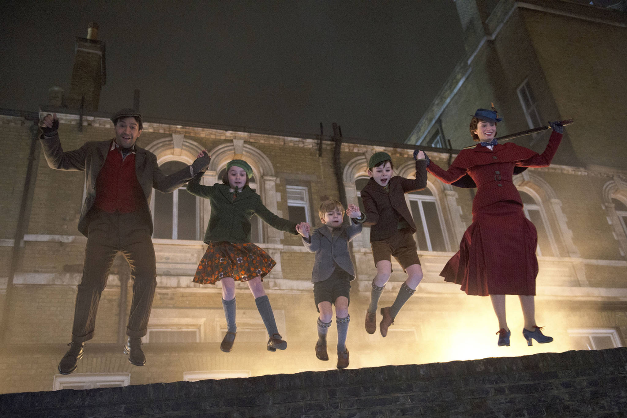 This image released by Disney shows, from left, Lin-Manuel Miranda, Pixie Davies, Joel Dawson, Nathanael Saleh and Emily Blunt in “Mary Poppins Returns.” (Jay Maidment | Disney via the Associated Press)