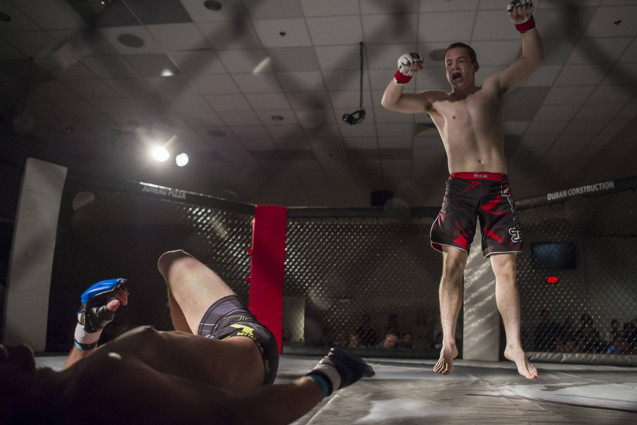 In this Oct. 20, 2017 photo, Alonzo Leisholmn Jr., right, celebrates his win against Nathan Herbig in their MMA fight at the AK Beat Down at Elizabeth Peratrovich Hall. (Michael Penn | Juneau Empire File)