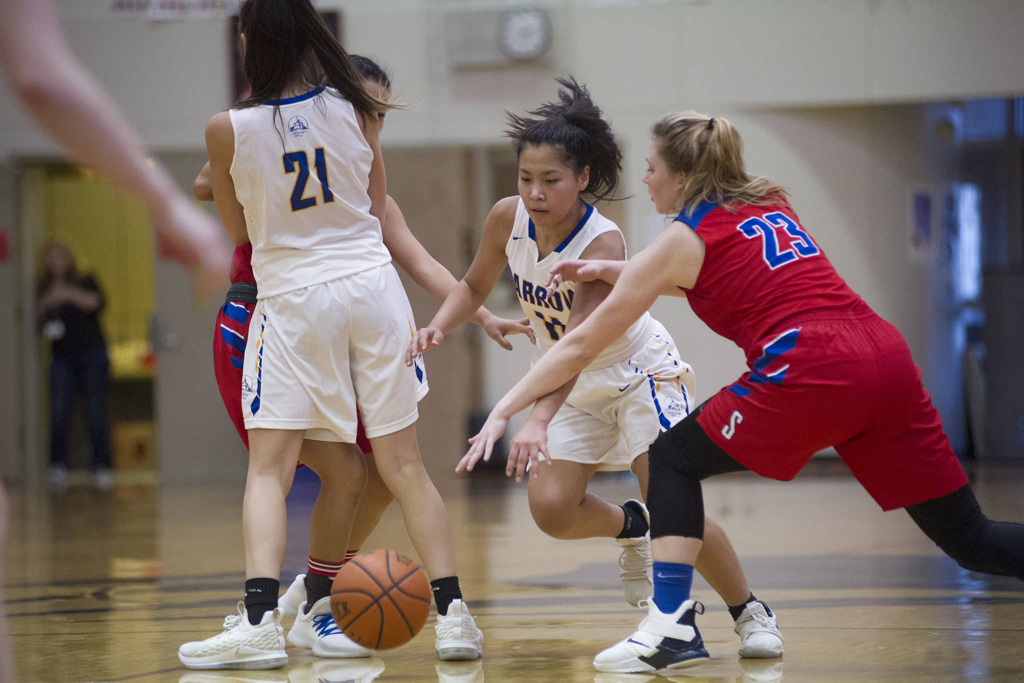 Barrow’s Lewanne Brower dribbles the ball in between teammate Jenilee Donovan and Sitka’s Abby Forrester at the Princess Cruises Capital City Classic at Juneau-Douglas High School on Saturday, Dec. 29, 2018. Barrow won 58-50. (Nolin Ainsworth | Juneau Empire)