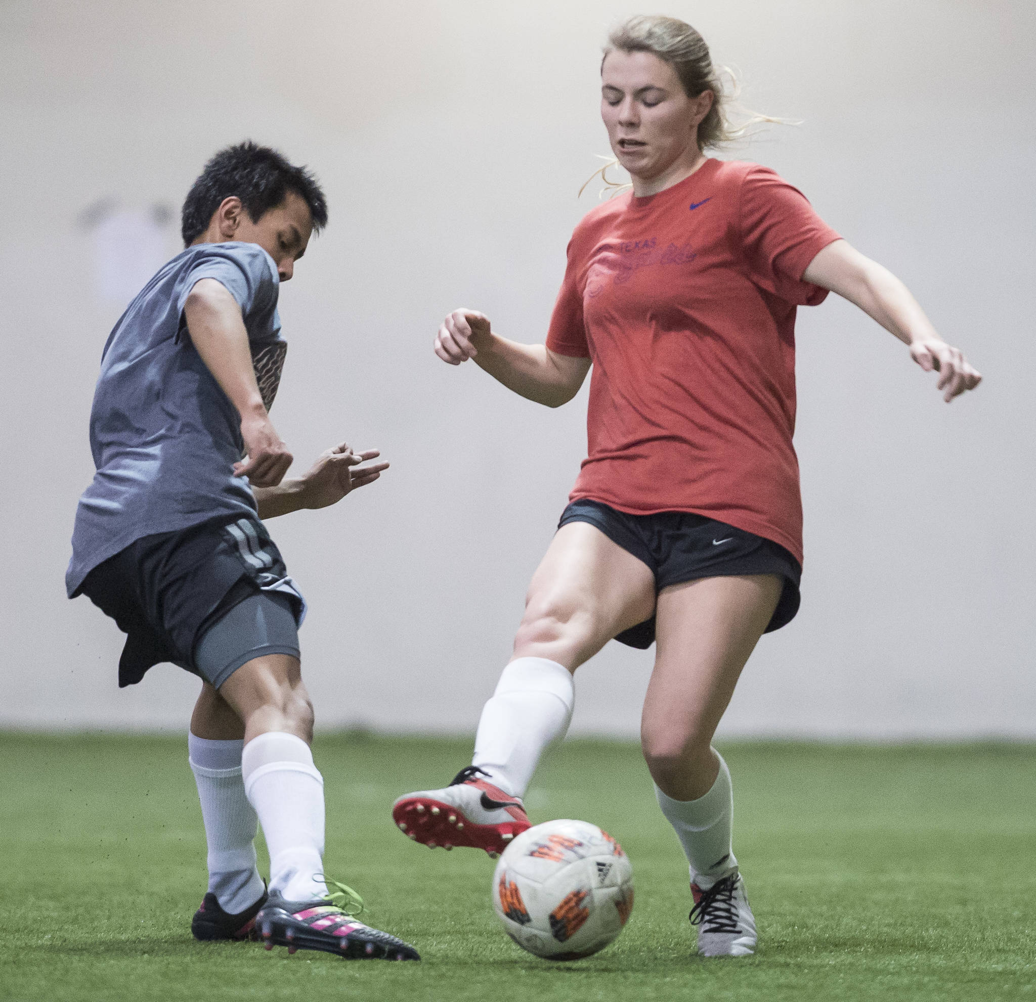 Grinch Gang, red, competes against Black Ice, black, in the finals of the senior division at the annual Holiday Cup Soccer Tournament at the Wells Fargo Dimond Park Field House on Monday, Dec. 31, 2018. The Grinch Gang won 8-2. (Michael Penn | Juneau Empire)