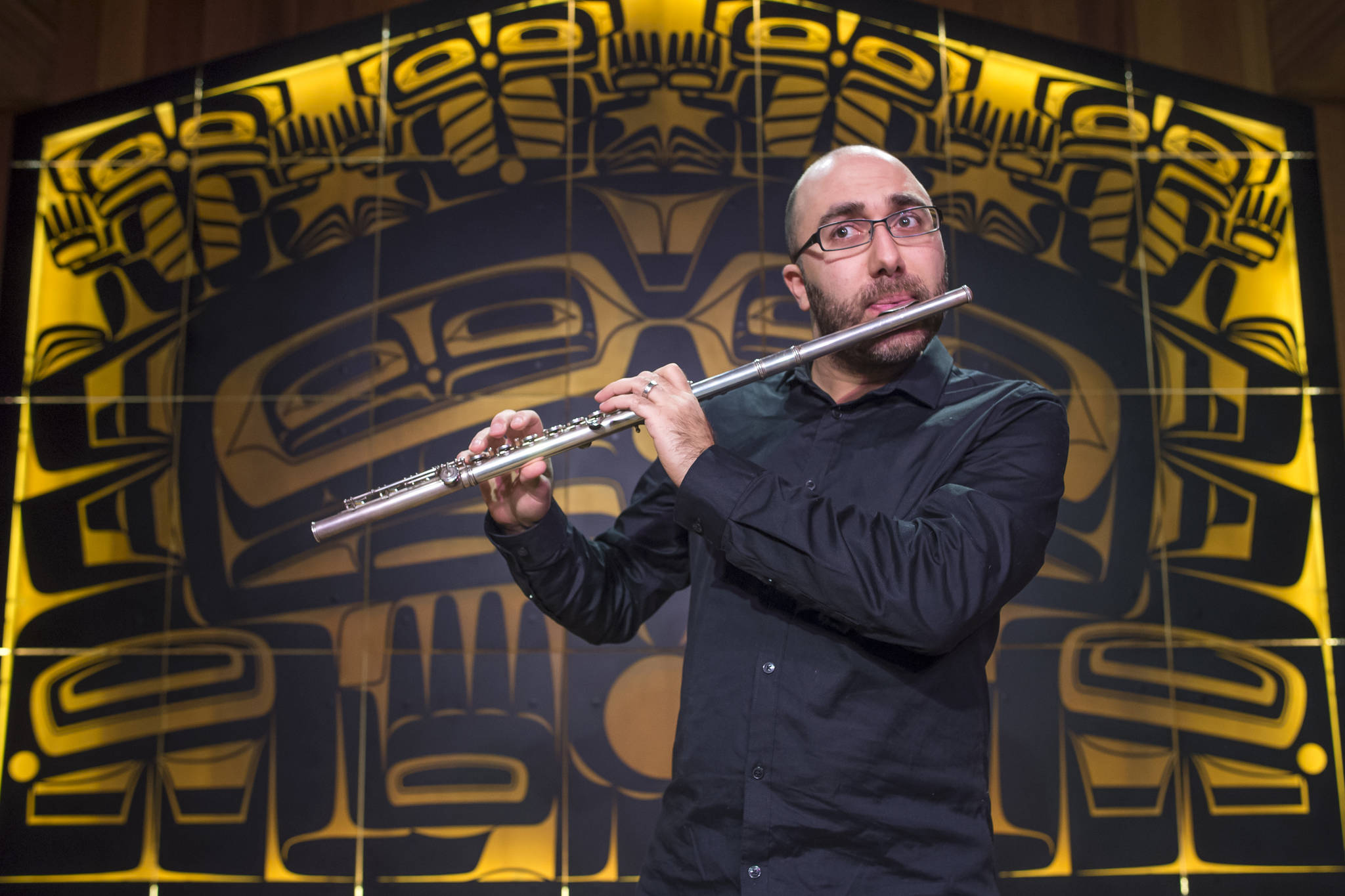 Armenian-American flutist Tigran Arakelyan, the Music Director of the Northwest Mahler Festival in Seattle and the Port Townsend Orchestra, performs a sound check in the Shuká Hít (Ancestors’ House) at the Walter Soboleff Center on Wednesday, Jan. 16, 2019. (Michael Penn | Juneau Empire)