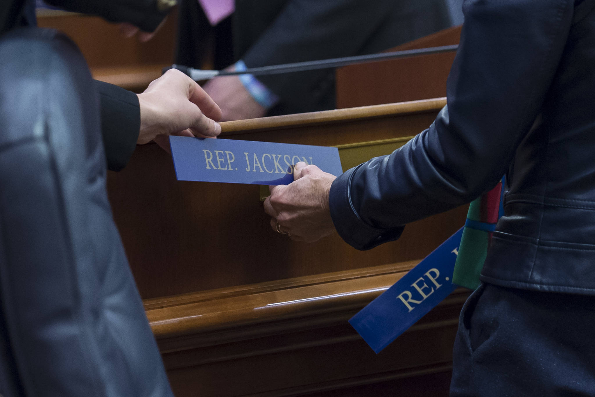 Rep. Sharon Jackson receives her desk name plate after being sworn into the House District 13 seat on Thursday, Jan. 17, 2019. (Michael Penn | Juneau Empire)