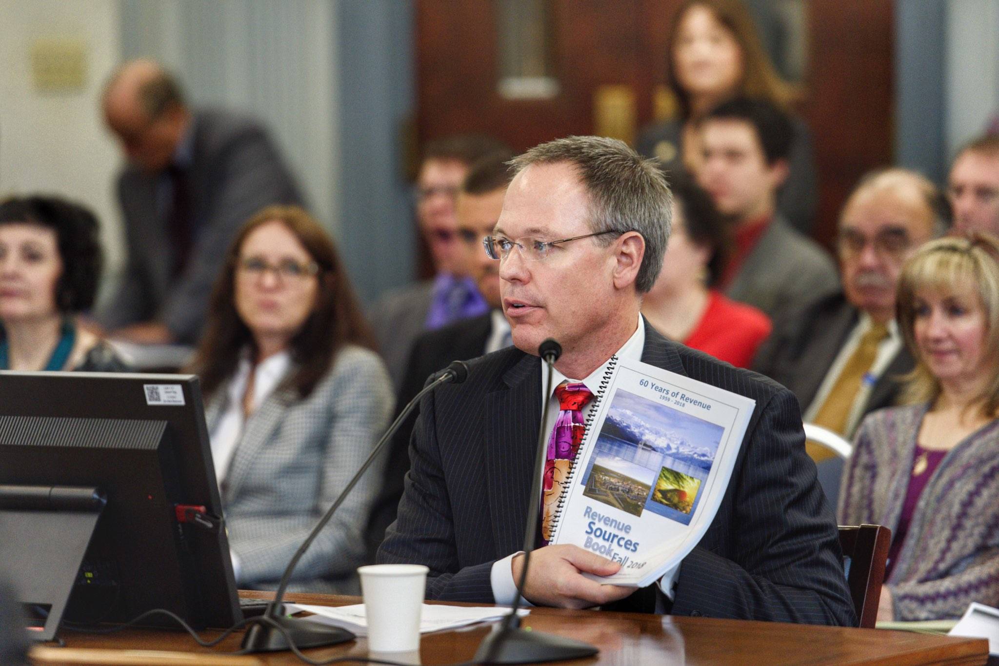Commissioner Designee Bruce Tangeman presents the state’s revenue forecast to the Senate Finance Committee at the Capitol on Wednesday, Jan. 16, 2019. (Michael Penn | Juneau Empire)