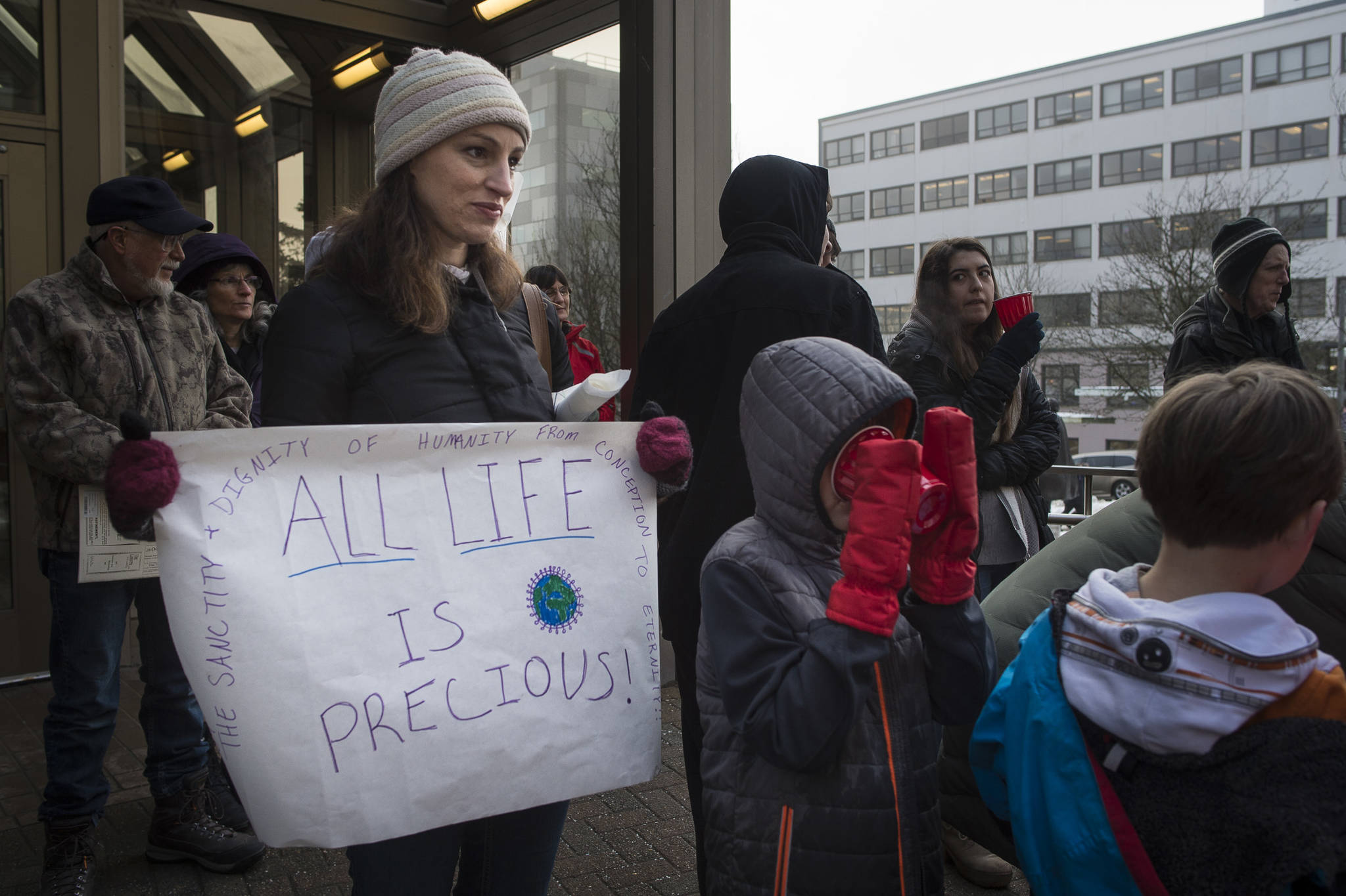 Rebecca Grimes attends the Alaskans for Life, Inc. annual Rally for Life with her children in front of the Capitol on Tuesday, Jan. 22, 2019. (Michael Penn | Juneau Empire)
