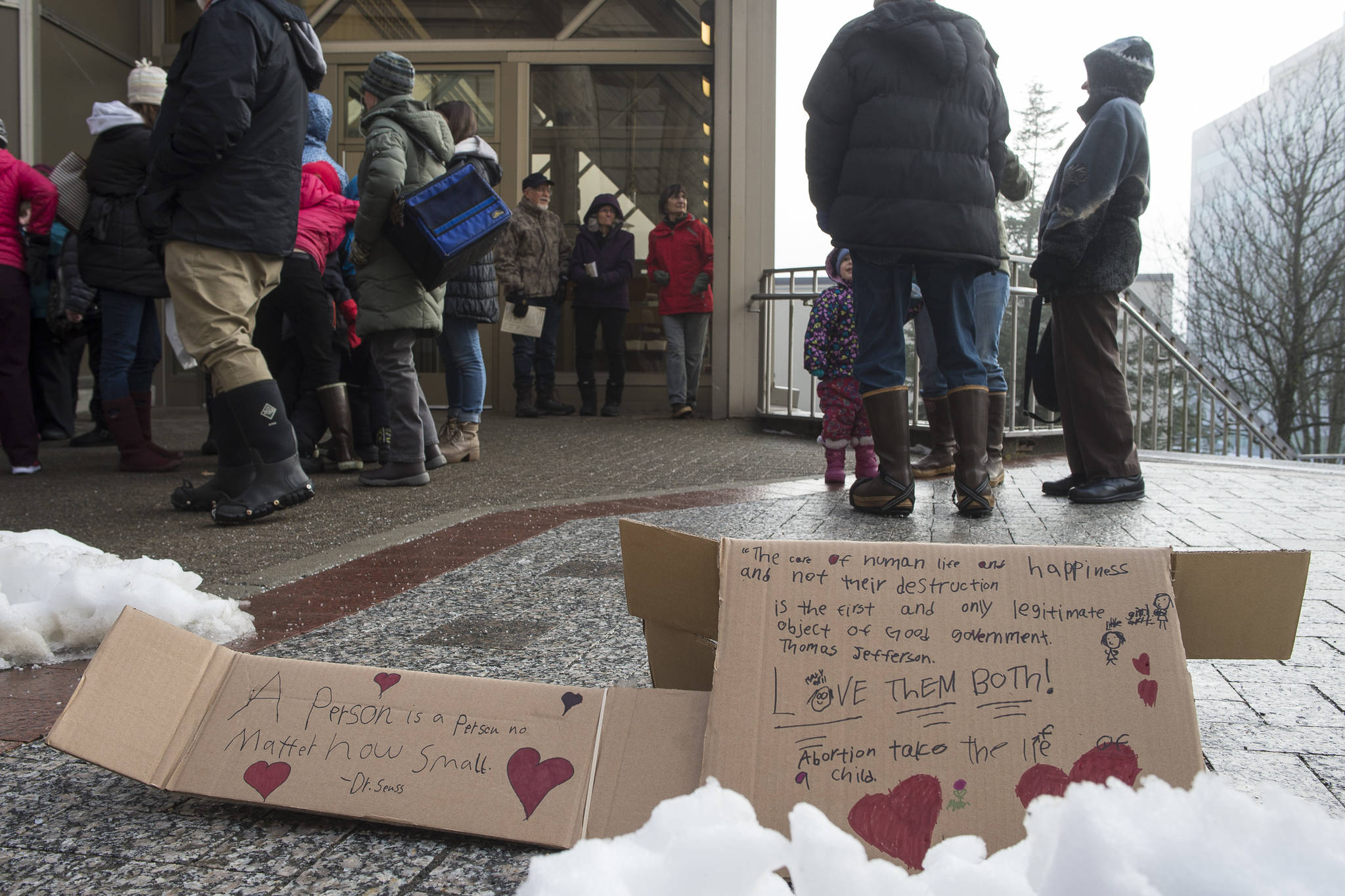 Signs left on the sideway after the Alaskans for Life, Inc. annual Rally for Life in front of the Capitol on Tuesday, Jan. 22, 2019. (Michael Penn | Juneau Empire)