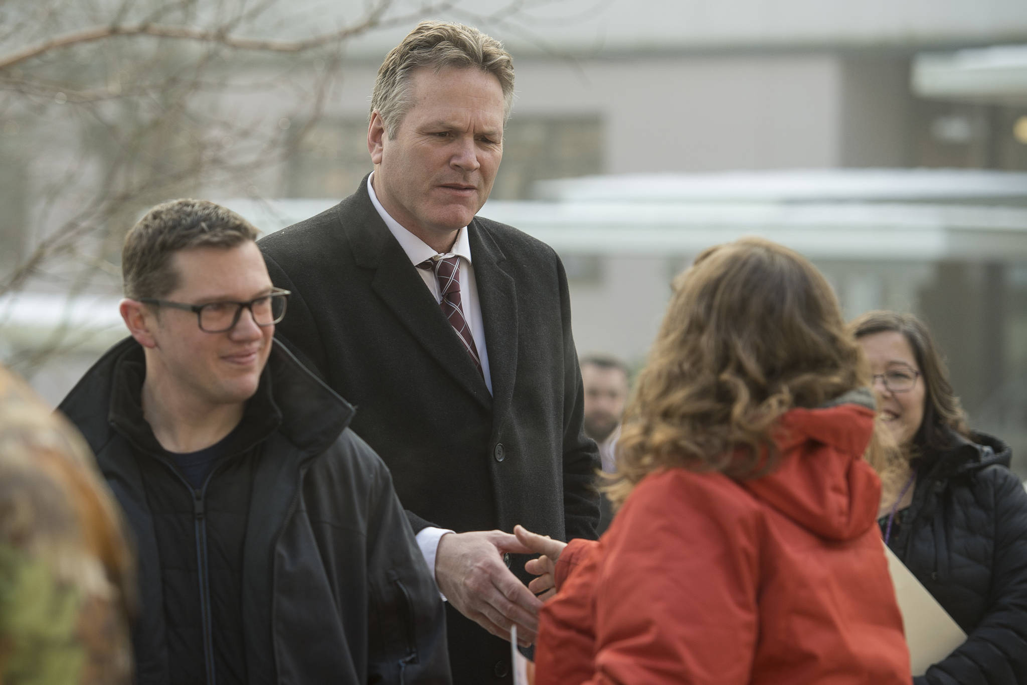 Gov. Mike Dunleavy is greeted by people attending the Alaskans for Life, Inc. annual Rally for Life in front of the Capitol on Tuesday, Jan. 22, 2019. (Michael Penn | Juneau Empire)