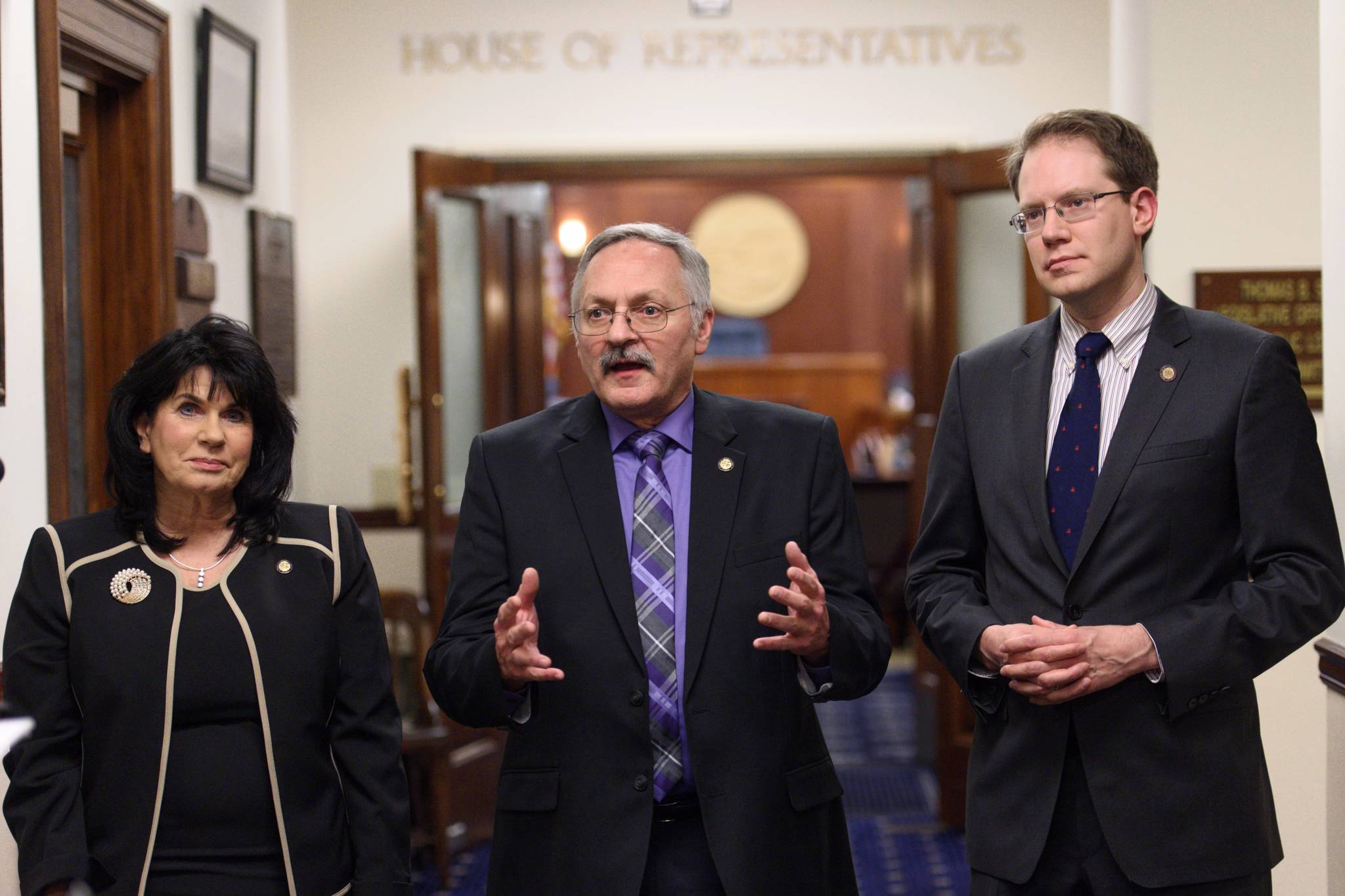 House Republicans Cathy Tilton, left, David Talerico, center, and Lance Pruitt speak to the press outside the House chambers after Gov. Mike Dunleavy’s State of the State speech on Tuesday. (Michael Penn | Juneau Empire)