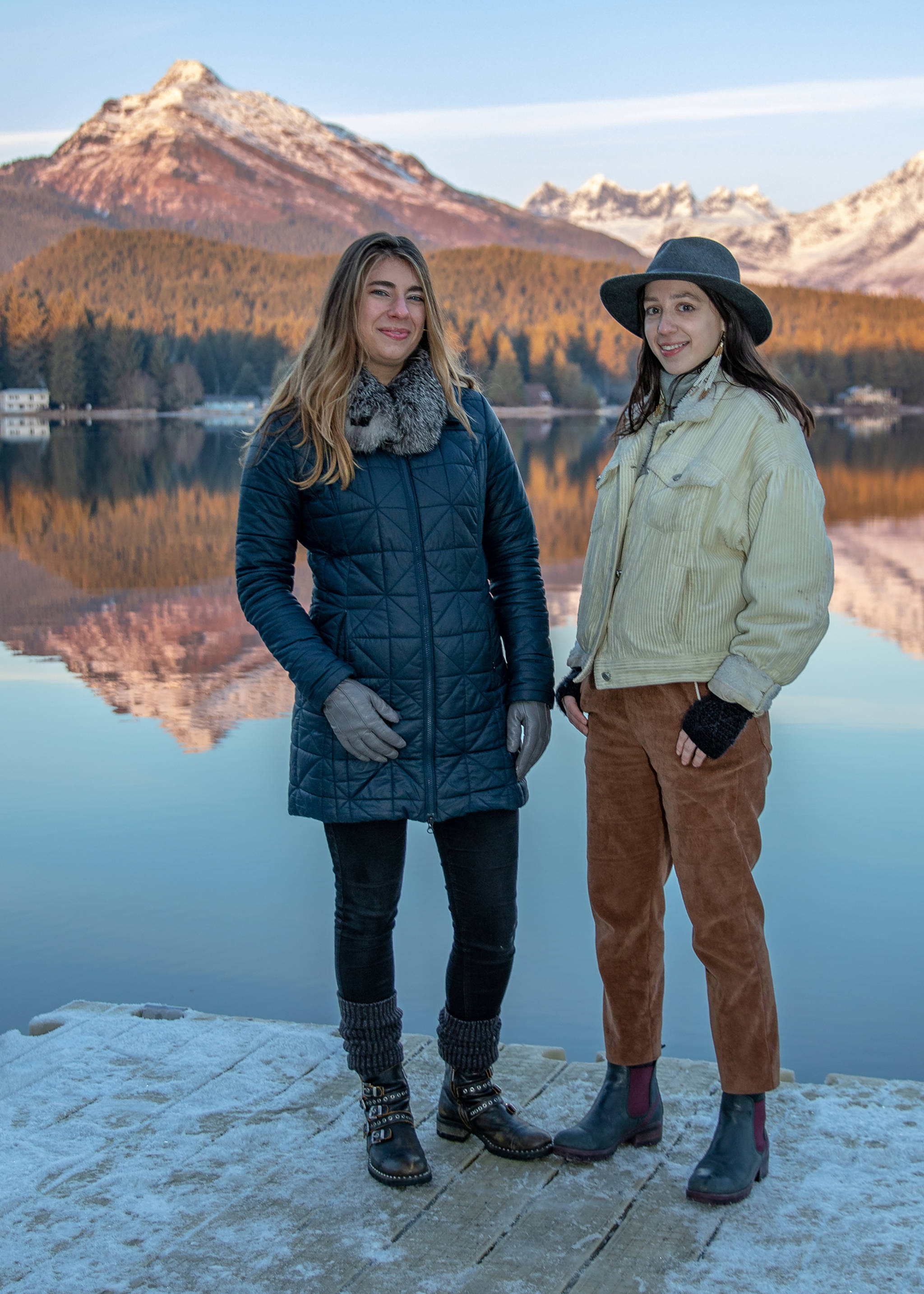 Dec. 16, 2018: On a cold December afternoon, Dana Herndon and Serena Drazkowski stopped by Auke Lake to catch the sunset. Dana was wearing a navy puff jacket from The North Face, black pants, UGG boots, Boheme texting gloves and a mink neck ruff. Serena stayed warm in brown corduroy overalls and white corduroy jacket, topped off by a gray Pendleton wool hat and black Bueno boots from Shoefly.