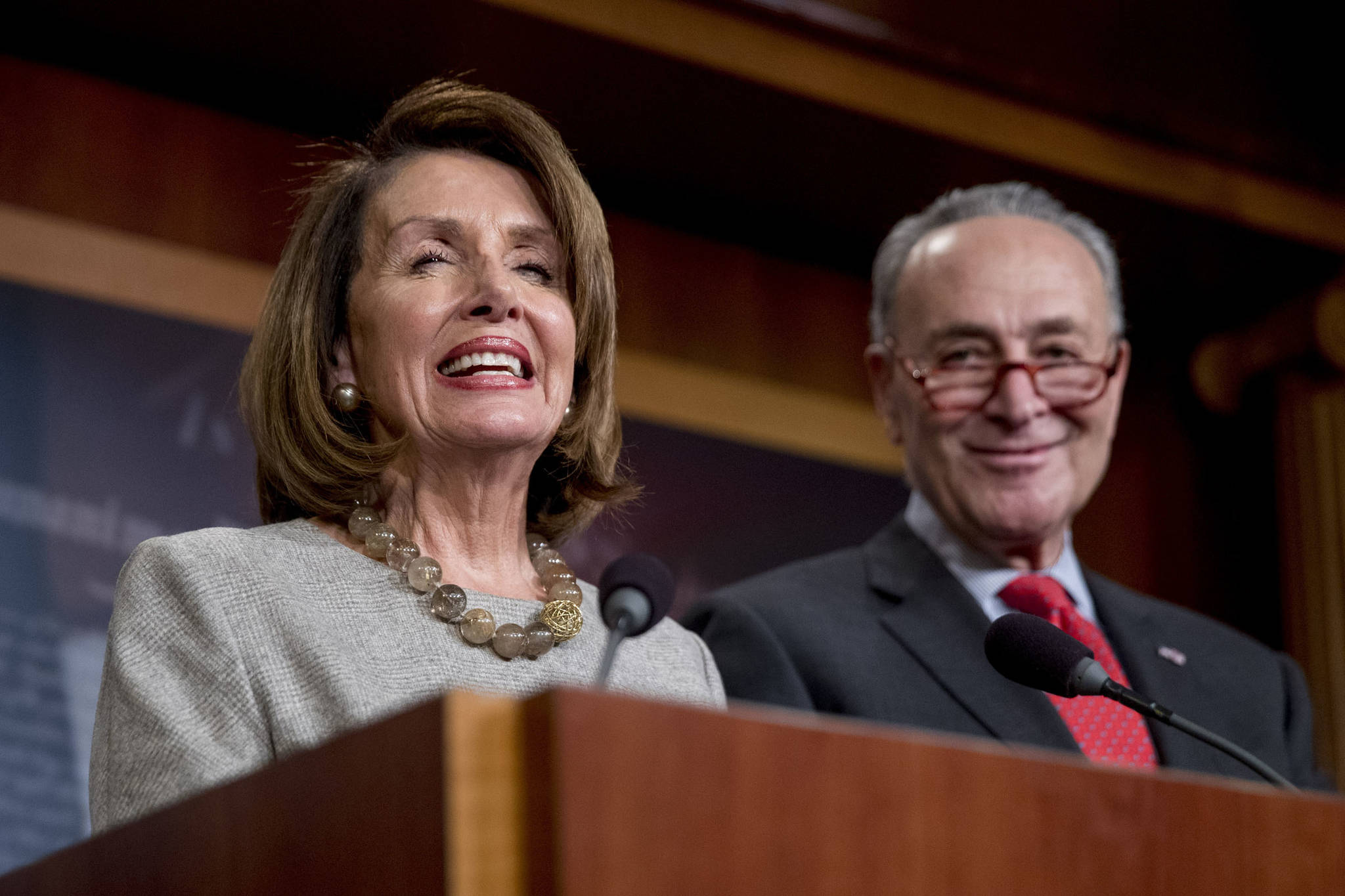 House Speaker Nancy Pelosi of Calif., and Senate Minority Leader Sen. Chuck Schumer of N.Y., smile during a news conference on Capitol Hill in Washington, Friday, Jan. 25, 2019, after President Donald Trump announces a deal to reopen the government for three weeks. (Andrew Harnik | Associated Press)