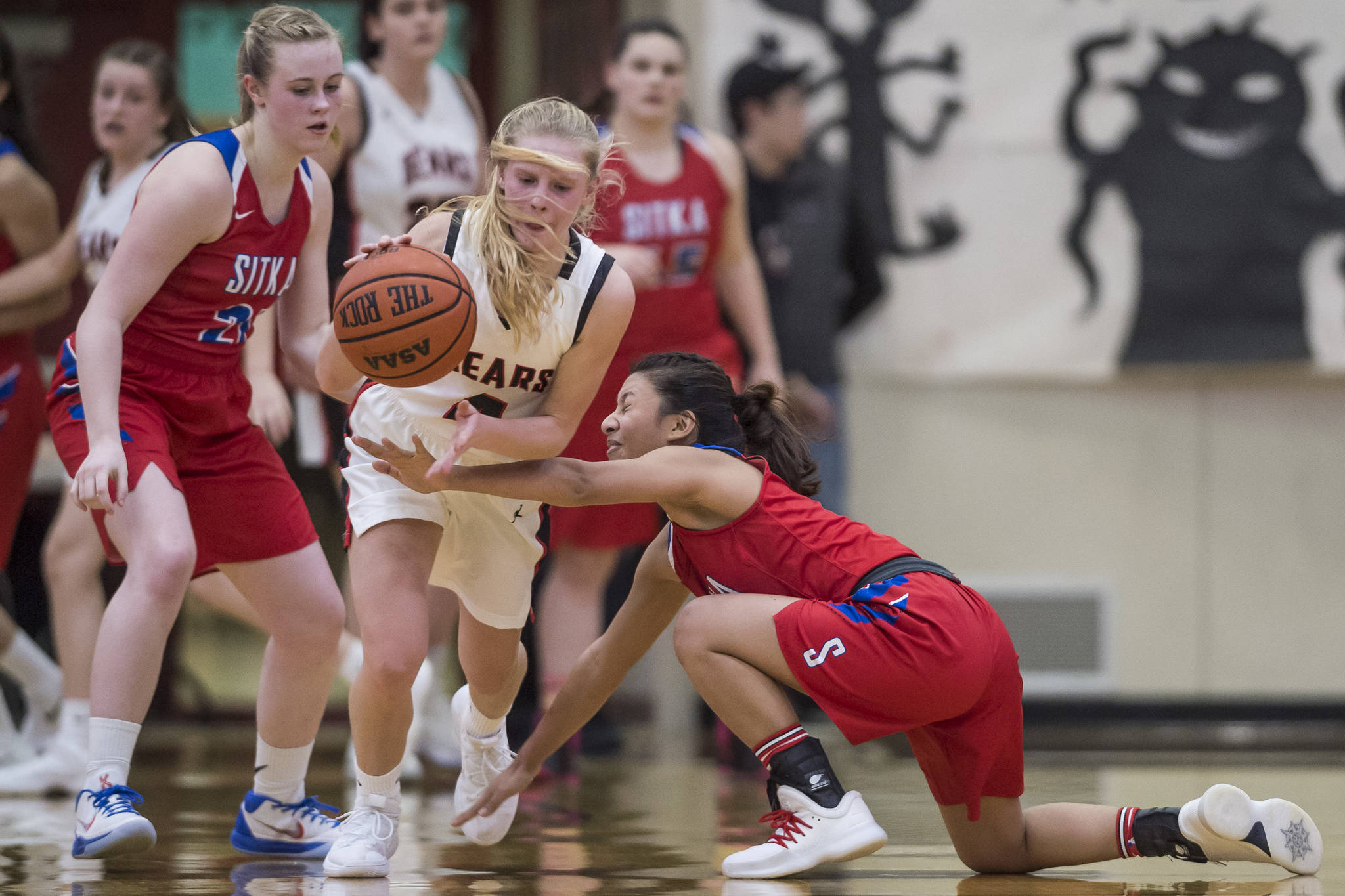 Juneau-Douglas’ Sadie Tuckwood, center, steals the ball against Sitka’s Tiffany Elefante, right, at JDHS on Friday, Jan. 25, 2019. Sitka won 37-31. (Michael Penn | Juneau Empire)