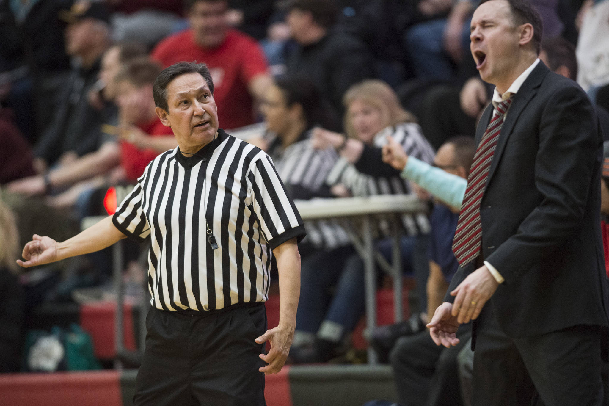 Juneau-Douglas’ coach Robert Casperson reacts to a technical foul call by referee Ron Taug as they play Thunder Mountain at JDHS on Friday, Jan. 25, 2019. Thunder Mountain won 67-63. (Michael Penn | Juneau Empire)