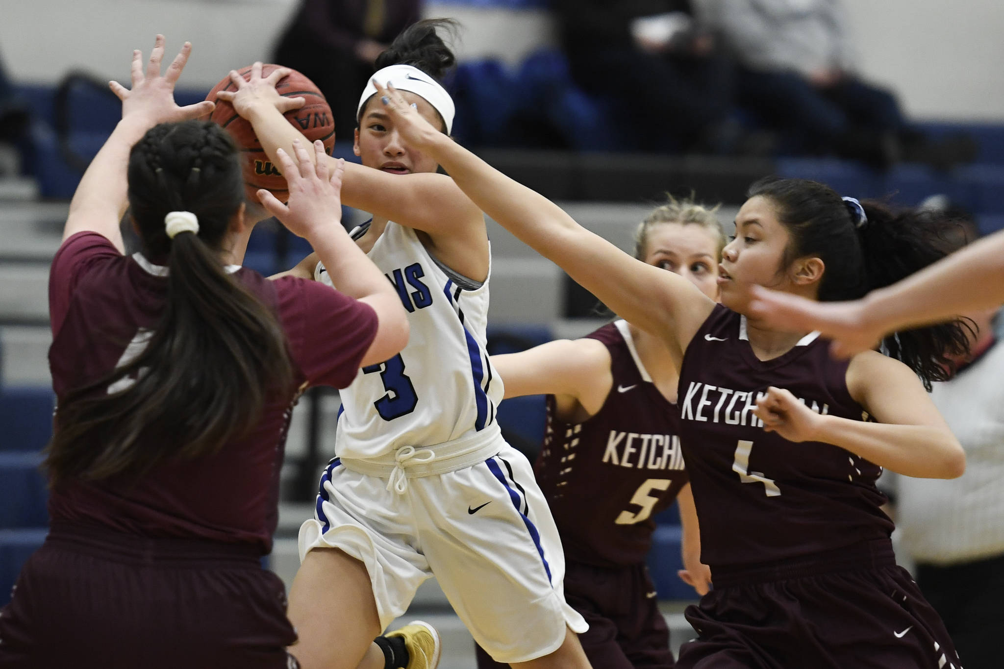 Thunder Mountain’s Mary Neal Garcia looks to pass against Ketchikan’s Nadire Zhuta, left, Emmie Smith, center, and Lianne Guevarra at TMHS on Friday, Jan. 25, 2019. Ketchikan won 42-36. (Michael Penn | Juneau Empire)
