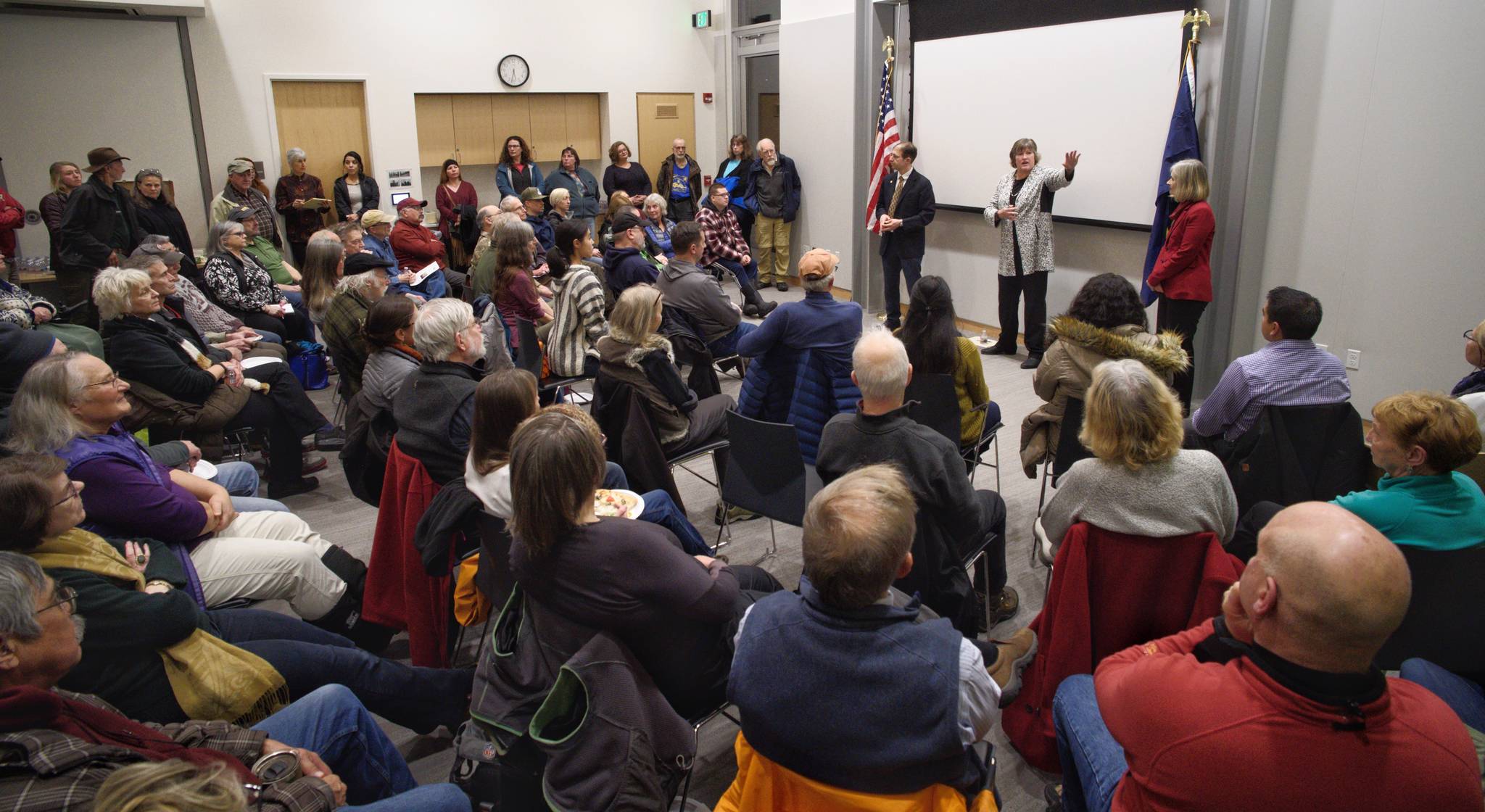 Juneau’s legislators, Sen. Jesse Kiehl and Reps. Sara Hannan and Andi Story, talk to a standing room only crowd at a town hall meeting at the Mendenhall Valley Public Library on Tuesday, Jan. 29, 2019. (Michael Penn | Juneau Empire)